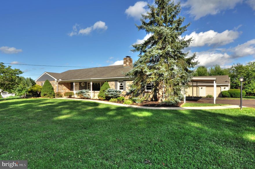 Sprawling Harleysville stone ranch home is ready for your creative touches.  The heart of this home is large living room with a stone fireplace and  large bay window. Three ample size bedrooms, along with a hall bath  that features a tub and separate  stall shower, and multiple hall linen and storage closets.  Eat in kitchen and dining area,  with sliding glass door that leads to a sun room with a wood stove.  This room  provides a great place to enjoy nature all year round.  The rear entry hosts a convenient powder room and laundry hook-ups. The attached 2 car garage also has an interior door to the house as well. The full unfinished basement provides additional space for storage. craft, hobby or work out space.  There is an over sized 2+ car detached garage with overhead storage, ideal for car enthusiast. In addition there is  rear storage for a motor home, travel trailer.  Conveniently  located to grocery,  eateries, schools, walking trails,  parks, and turnpike  access.  Just a great place to call home.