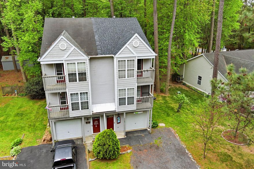 Easy, low-maintenance living in the heart of Rock Hall. New roof and central air in Spring 2026. This updated 3-bedroom, 2.5-bath townhome with garage is perfectly positioned just steps from marinas, Main Street shops, favorite restaurants, and the community beach. Recent improvements include luxury vinyl plank flooring, newer appliances, new roof, central air, and fresh paint throughout. The entry level offers a flexible bedroom or home office with en-suite bath, while the main living level features a seamless flow from kitchen to dining and family room—ideal for everyday living and entertaining. Upstairs, the primary bedroom boasts vaulted ceilings and a private balcony, alongside an additional bedroom and full bath. The garage provides ideal storage for water toys, fishing gear, or a golf cart. Whether you’re looking for a full-time residence or an easy weekend escape, this home delivers the best of Rock Hall living.