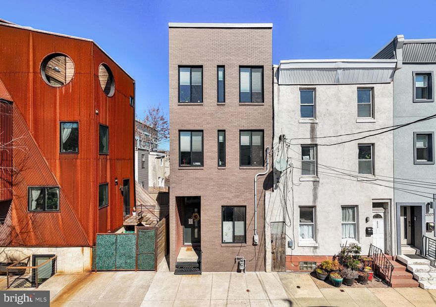 Welcome to 2003 E York Street, a beautifully designed 4-bedroom, 3.5-bath  3,000+  SqFt  home set on an exceptionally rare 85-foot-deep lot in East Kensington// Fishtown. With several years remaining on its tax abatement, this property offers incredible value—paired with one of the largest private backyards in the neighborhood. Whether you're hosting a summer barbecue, planting a garden, or simply enjoying a quiet morning outside, this yard is your private oasis in the city.

Inside, the home is flooded with natural light and offers an expansive layout that’s perfect for both entertaining and everyday living. The sun-soaked first floor is truly impressive—wide open and thoughtfully designed, with distinct spaces for lounging, dining, and cooking. The sleek modern kitchen is centrally located and flows effortlessly into the oversized living and dining areas, all with direct access to the backyard for ideal indoor-outdoor living.

Upstairs on the second level, you'll find two spacious bedrooms, one with an ensuite bathroom and a large second bath in the hall. On the third floor you will find two additional beds one of which is a luxurious primary suite with a spa-inspired bath and walk-in closet. Every room feels bright, airy, and functional. A third and fourth bedroom are perfect for guests, a home office, or flex space. The finished basement adds even more living space—perfect for a media room, playroom, gym, or additional guest suite. And don’t miss the private roof deck, where you can enjoy sweeping city views and sunset cocktails all year round.

The location is just as impressive. Only 1.5 blocks from the York-Dauphin El Station, you're just a 10-minute train ride to Center City. With a Walk Score of 96, daily errands, dining, and nightlife are all within easy reach. You’re steps from local favorites like Philadelphia Brewing Company and Picnic on Martha Street, with top restaurants like Suraya, LMNO, Kalaya, and Green Eggs Café nearby. Spend weekends in Norris Square Park, Penn Treaty Park, or exploring the neighborhood’s artistic energy through galleries, community events, and vintage shops.

At 2003 E York Street, you’ll enjoy the best of modern city living—abundant space, sunlight, style, and one-of-a-kind outdoor amenities—all in one of Philadelphia’s most vibrant and creative communities