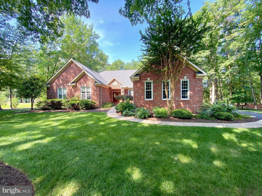 ​Gorgeous custom Dream Home sited on a beautiful lot overlooking the majestic Fairway of the Fawn Lake golf course inside the luxury community of Fawn Lake. Designed for casual main level living, this charming brick ​Rancher offers a semi-open floor plan filled with​ beautiful details at every turn.  
​Double doors welcome you to a grand Living Room sitting at the center of the home. Featuring soaring trey ceilings, brand new hardwood floors, Palladium windows, fresh paint and plenty of inviting space to gather and entertain. ​
The Chefs Kitchen with solid Oak cabinets, new stainless steel appliances, granite counters and hardwood floors, features a charming sunlight Breakfast ​nook with French doors that provide access to the inviting screened Porch. 

The Family Room features a ​gas fireplace ​flanked by custom built-in bookcases and media cabinetry. French Doors lead​ to an expansive deck and a charming screened Gazebo, offering extended living and entertaining opportunities while overlooking the peaceful backyard, and golf course just beyond.
The gracious Main Level Owner's Suite with a sunlight Sitting Room, offers a large walk-in closet and a luxurious Spa Bath with soaking tub, tile shower and​ a huge vanity with dual sinks.
Two additional spacious bedrooms with walk-in closets are anchored by a Full Bath. A beautiful private Den serves as a perfect home office or guest room. 
A Convenient Laundry Room with ​utility sink and ​cabinetry, ​along with a Powder Room completes the Main Level.

The large unfinished basement provides plenty of storage and space for future expansion.
An oversized 3-Car Garage and extended driveway provide ample parking and auto storage.  
Meticulously maintained, the home features a New Roof ​installed in 2018, along with new gutters. The new energy efficient HVAC was installed in 2021. The water heater was installed in 2023. The ​beautifully landscaped grounds are easily maintained with the in​-ground irrigation system​ installed on the property.​ Custom built, this charming home is perfectly nestled on a quiet street on a beautiful .91 acres surrounded by mature hardwood and blooming trees providing wonderful views of nature and privacy!
Located ​in a super desirable established area right in the heart of ​Fawn Lake, within walking distance to the Country Club Restaurants, tennis, golf, beach, fitness center, marina and all the wonderful amenities Fawn Lake has to offer!
Come experience what the Fawn Lake lifestyle is all about where every day is a vacation!
**The beautiful Luxury Fawn Lake Community offers amazing amenities such as a boating recreational lake, beach, Arnold Palmer designed golf course, tennis courts, baseball and soccer fields, dog park, volleyball courts, walking trails, Community Clubhouse, marina, fitness center, restaurants, Country Club, playgrounds, and so much more! Located in the countryside near the town of Fredericksburg, VA, surrounded by park lands and only a few miles to the farm market, wineries, and award winning breweries! Conveniently located to shopping, restaurants, top-rated Riverbend District schools, and I-95.