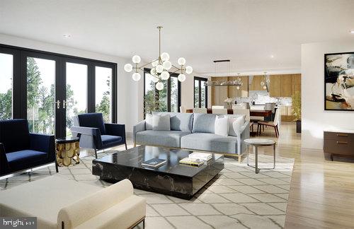 Welcome to Wayne 427, brand new luxury residential condominiums in a premier Main Line location. The Main Line has never seen architectural design and luxury living like this before! This expansive contemporary condo with 3 bedrooms and 2.5 elegant baths is a fine expression of thoughtful design, with exquisite living quarters and private covered terraces for outdoor enjoyment. Here you will fine high-end finishes and amenities, along with utmost convenience and security in the neighborhood s most distinctive upscale condo community. Every home is a corner unit positioned to optimize light and views through the floor-to-ceiling windows. This stylish residence welcomes you with a gracious entry foyer and offers a seamless flow for entertaining, with a stunning sun-bathed great room that incorporates open living, dining and kitchen areas. Airy 9+ ceilings, custom millwork, hardwood and carpeted floors, a custom fireplace, solid core Masonite interior doors with designer hardware, detailed recessed & decorative lighting, generous closet space with walk-ins, and a laundry room are among the alluring features. The gourmet kitchen is tailored to the chef with custom-designed cabinetry, sleek countertops, top-quality appliances, and a center island with seating. Bathrooms clad in tile and marble are beautifully appointed with custom cabinets and premium fixtures. The master bath heightens the pampered experience with double sinks, soaking tub, and separate shower with frameless glass door. Bedrooms are comfortably sized and privately separated from the living space. Situated in a scenic partially-wooded setting, Wayne 427 is comprised of 2 condo buildings with 11 homes in each and only 4 units per floor. The striking design and meticulous craftsmanship create a modern presence in a well-established neighborhood. A green roof garden & pet-friendly park centers the buildings, and lush plantings surround the perimeter lending serenity and privacy. Dramatic main entryways boast metal clad towers enclosing the stairs and vertical glass walls filtering light into the lobbies and corridors at each level. Custom-fitted elevators, keyless entry, an underground parking garage, energy-efficient systems, individual storage lockers for each residence, a well-equipped gym, meeting room, mail/package room, 24/7 emergency maintenance plus landscaping and snow removal services enhance the low-maintenance luxury lifestyle. Perfectly situated on desirable Lancaster Ave, Wayne 427 is a short walk to historic Wayne, in the heart of the Main Line. You are just steps from shopping, dining, parks, top-rated Radnor Schools, and the train to Center City!