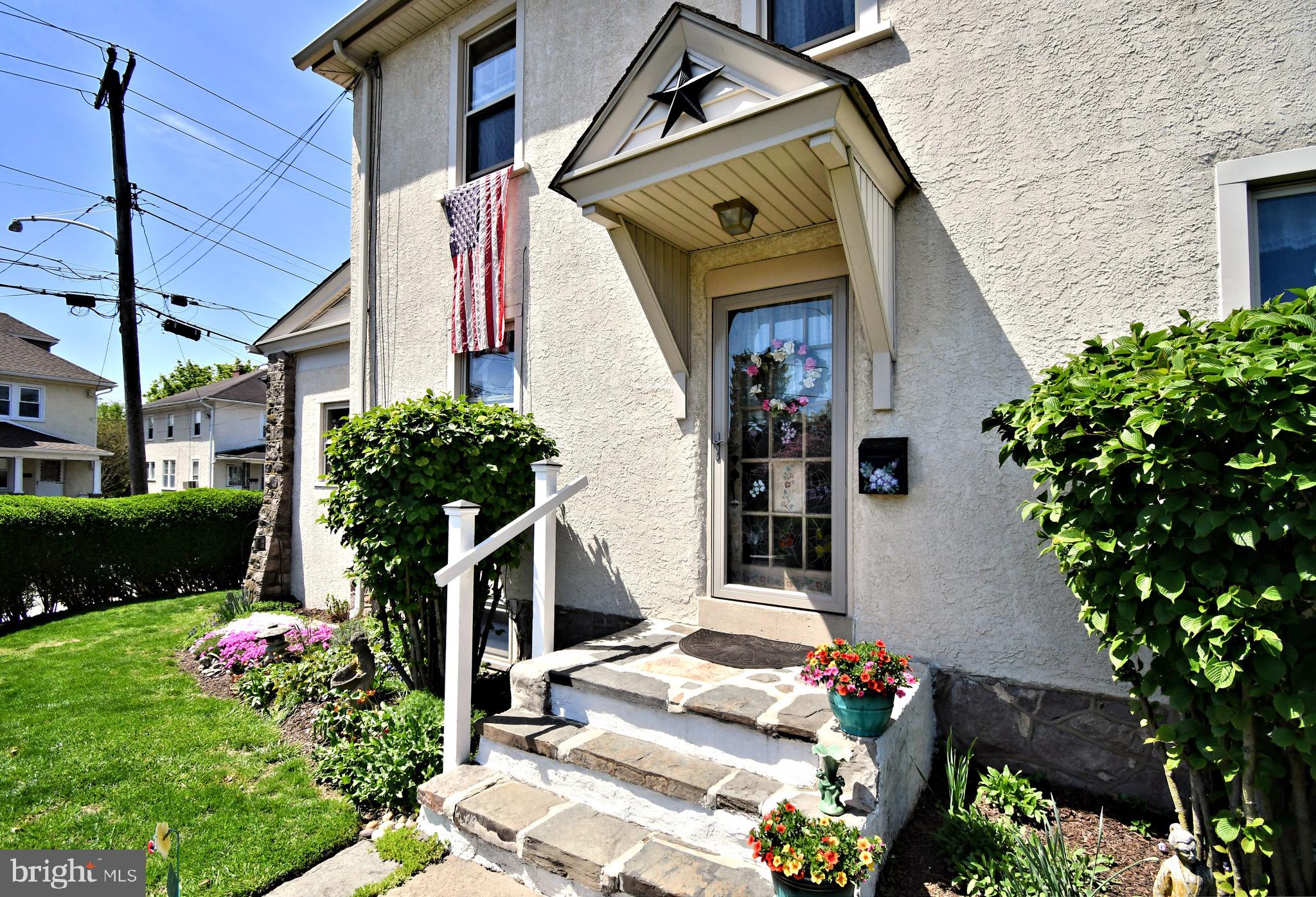 Welcome to this impeccably maintained Colonial home in the heart of Ambler Proper!
This charming 1920s residence is sure to exceed your expectations with its perfect blend of classic character and modern comfort.
You’ll be immediately impressed by the beautifully landscaped grounds, bursting with colorful flowers and mature plantings that provide visual interest year-round. Step through the front door into a welcoming foyer, where you’ll notice the home’s original details—arched doorways, gleaming hardwood floors, and timeless craftsmanship.
To the left, the spacious living room is bathed in natural light and features a cozy wood-burning fireplace. Just beyond is a charming den or study with striking stone walls—formerly the home’s original porch—offering a quiet retreat or inspiring workspace.
On the opposite side of the foyer, the large formal dining room also boasts abundant sunlight and is ideal for entertaining or hosting holiday gatherings. The delightful kitchen offers ample storage and workspace, along with a convenient powder room and direct access to a delightful back porch—perfect for your morning coffee or relaxing afternoon breaks.
Upstairs, you’ll find three generously sized bedrooms and a full hall bath, all filled with natural light and equipped with ample closet space. A walk-up attic with original built-ins offers fantastic storage or the potential for additional living space.
This turnkey home is ready for you this summer, featuring central air conditioning and a new furnace installed in 2018.
Located just a short stroll from Main Street Ambler, you’ll enjoy easy access to the movie theater, live music, acclaimed restaurants, and all the charm this vibrant community has to offer.
Don't miss this one-of-a-kind opportunity to own a piece of Ambler history. Schedule your tour today!