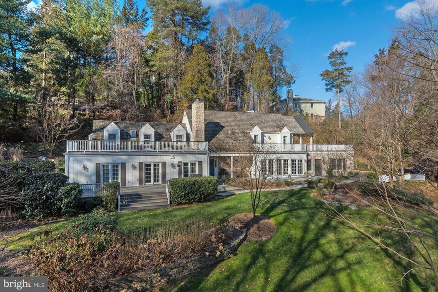 NEW PRICE! Private wooded setting only minutes to DC, Tysons & Reagan National and Dulles airports. Interior presents updated chef's kitchen, remodeled bathrooms and entry, hardwoods, wood-paneled great room and upstairs master suite, downstairs guest suite. Fully landscaped exterior with salt pool, flagstone patios and extensive decks for entertaining. Oversized two-car garage.