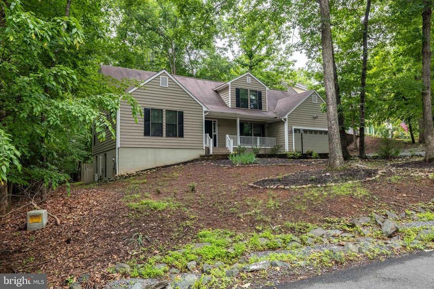 PRICED BELOW APPRAISAL!!! NOW VACANT! Stunning 4-Bedroom Home with Water Views at Lake Monticello! Discover the perfect blend of comfort and luxury in this beautifully maintained 4-bedroom, 3-full-bath home nestled in a quiet cul-de-sac at Lake Monticello. Enjoy breathtaking water views. Step inside to brand-new carpeting throughout and a COMPLETELY RENOVATED basement, offering additional living space or a private retreat. The main living areas are bright and inviting, featuring a cozy wood-burning fireplace—perfect for chilly evenings. The kitchen boasts gas cooking and a an eat in kitchen and plenty of storage space, making meal prep a breeze. Outside, the fenced rear yard provides privacy, while the lot extends beyond the fence for even more space to enjoy. A spacious back deck is ideal for entertaining, whether you're hosting a summer barbecue or enjoying peaceful lake views with your morning coffee. Amazing amounts of storage throughout the entire home! Garage is also equipped with a plug to charge an EV.  Seller has covered the cost of the annual HOA for 2025, as well as a home warranty paid through August. With access to Lake Monticello’s premier amenities—including a golf course, pools, tennis courts, restaurants, and a bar—this home offers an unparalleled lifestyle in a serene, lake setting. NO DIRECT ACCESS TO THE WATER FROM BACKYARD. Don't miss your chance to own this incredible lakefront retreat—schedule your showing today!