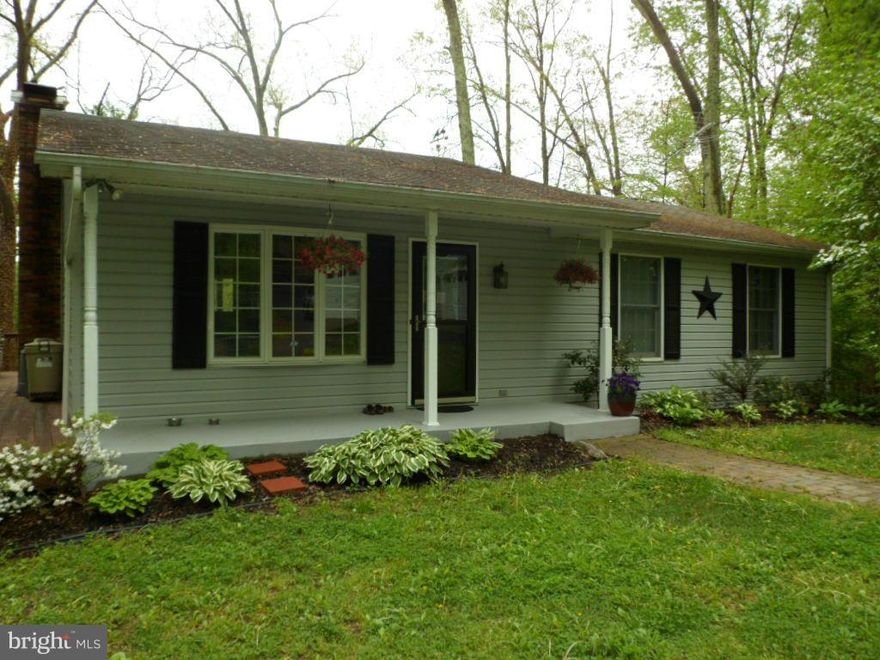 BRING THE HORSES. Amazing find in the country, Home sits on 5 acres, mostly cleared, fenced pasture, Horse stable, regular shed, RUN IN shed for extra storage. Home has 3 bedrooms/3 bathrooms completely remodeled. Updated kitchen. Wood burning fireplace with a pellet stove on the lower level. Entertain or Sit out with family on the wrap around deck overlooking an amazing view of the open pasture.