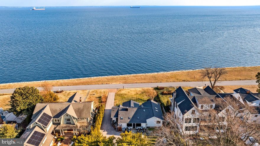 Welcome to one of Annapolis’ most coveted addresses, perfectly positioned within the vibrant waterfront community of Bay Ridge, where the rhythm of daily life is defined by the water, the shoreline, and a true sense of connection. Set on a level, manicured lot with sweeping Chesapeake Bay views, this property offers a front row seat to ever changing scenery, from passing sailboats to colorful skies stretching across the horizon. With sandy beach access just across the street, the Bay becomes an extension of your everyday lifestyle, ideal for spontaneous swims, paddleboarding at sunrise, or unwinding along the shoreline at day’s end.

Inside, the home is thoughtfully designed to complement its surroundings. The remodeled kitchen and updated baths blend comfort and style, while the great room with its panoramic water views serves as the heart of the home, seamlessly connecting indoor living with the beauty just beyond. A cozy fireplace creates the perfect setting for cooler evenings, and a dedicated home office provides flexibility for modern living.

Outdoor spaces further elevate the experience. The covered patio invites slow mornings with coffee as boats glide by and evenings under the stars with the Bay as your backdrop. After a day spent on the beach or out on the water, the outdoor shower offers a simple, refreshing return to home. The conditioned garage adds versatility, easily accommodating a home gym, studio, or additional recreational space.

The sought-after Bay Ridge Community features a plethora of amenities including community pool with a clubhouse that overlooks the beautiful waters of the Bay, community beaches on both the River and the Bay and a community Marina with a newly renovated clubhouse. Off-the-water activities include enjoying the basketball court, playground, ball fields, pickleball courts, common areas and year-round community activities. Walk or ride your bike for miles along the water and enjoy all the benefits of the Bay Ridge lifestyle, there is no other place like it! Located just minutes from downtown Annapolis and Eastport which offer the perfect balance of small-town charm and big world sophistication. Traveling or commuting is just as convenient by easily accessing Rt. 50 and 97 which provides direct access to Baltimore, BWI, Ft. Meade/NSA and Washington, DC., or head over the Bay Bridge to the Eastern Shore for a quick beach vacation. Welcome Home!
