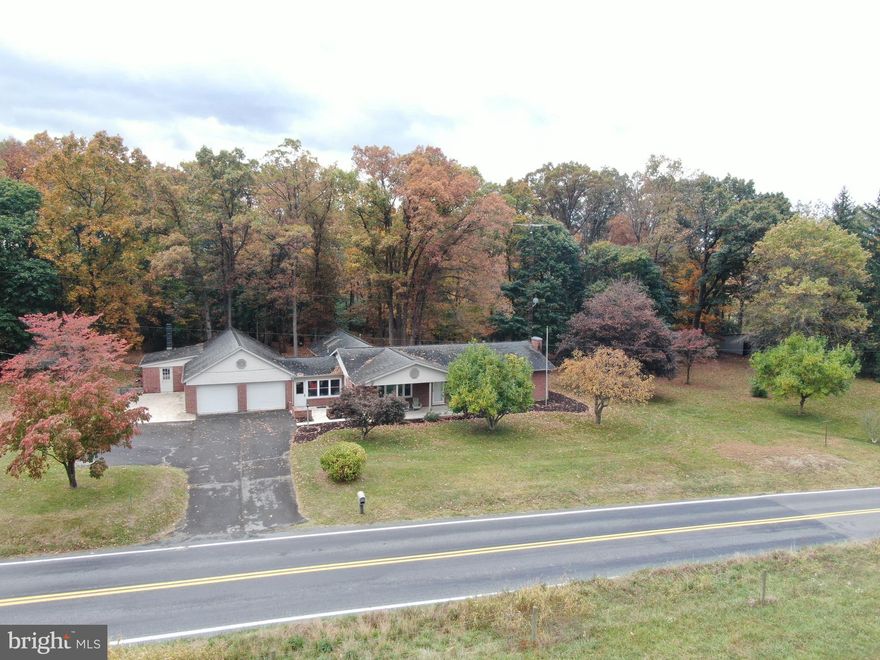 SPACIOUS RANCHER IN A BEAUTIFUL COUNTRY SETTING! Enjoy peaceful country living with breathtaking views of the surrounding mountains and farmland in every direction. This wonderful home offers plenty of space and versatility, featuring 3–4 bedrooms, 1 full bath, and 2 half baths. The interior includes a family room with cathedral ceiling, office, kitchen, dining area, living room, mudroom/breezeway, basement family room with fireplace, laundry room, and abundant storage throughout. An attached 2-car garage with attached 17x34 workshop provides ideal space for hobbies or projects. Outside, relax on the welcoming front porch or private back patio while enjoying the tranquil surroundings. The property also includes a 25x29 pole shed and utility shed for additional storage or workspace. Situated on two parcels totaling nearly 2 acres, there’s ample room for recreation, gatherings, and outdoor enjoyment. All this in a serene rural setting just a few miles from Route 30. Come experience the charm and space this country home has to offer! This property will be offered at auction on Tuesday, November 18, 2025, at 3:00 PM. The List price in no way represents a minimum, starting, or acceptable bid.