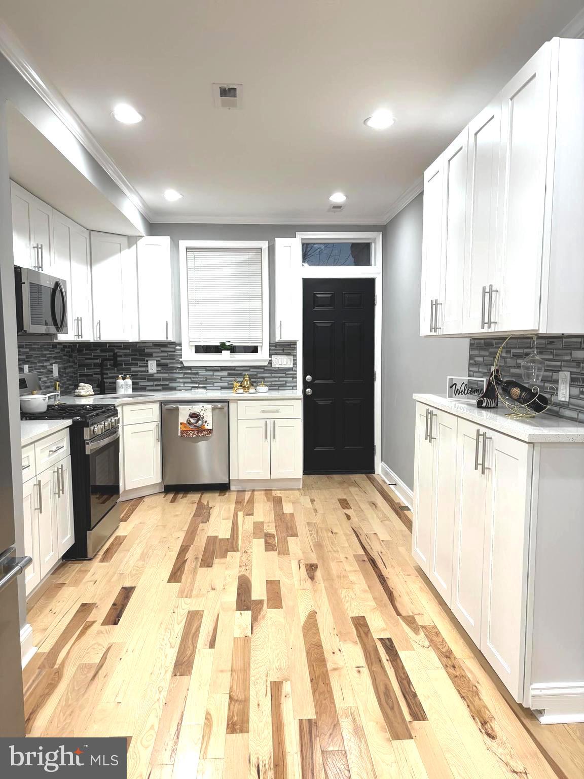 Attention!! Price Improvement! Motivated seller!
Welcome to Your Dream Home!
Step into this stunning, completely renovated gem in the heart of Baltimore! Boasting over 2,000 square feet of living space, this home features 5 spacious bedrooms and 4 luxurious baths, including a magnificent master suite with a private bath.
Every inch of this home is brand new—plumbing, HVAC, electrical systems, and flooring—providing worry-free living for years to come. You'll fall in love with the specially treated wood floors and tall ceilings that lend an air of modern elegance throughout.
The open-concept layout highlights a state-of-the-art gourmet kitchen, complete with sleek finishes, and flows seamlessly to a deck overlooking a private patio with a 6-foot privacy fence. The rear parking pad adds ultimate convenience.
The fully finished basement offers 2 additional bedrooms with an independent entrance—perfect for guests, in-laws, or rental potential. Relax on the charming front porch or enjoy outdoor gatherings on your deck.
Don't miss this meticulously designed dream home that combines modern touches with classic charm. Schedule your showing today!