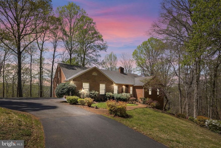 <b>$1,000,000 view includes a great home!</b> Spectacular brick one-level home with finished basement is a rare find on 4.17 acres and located within the city limits of Fredericksburg! The views from the home and property of the Rappahannock River as it bends toward historic Fredericksburg are a breathtaking spectacle. 5 minutes to anywhere in Central Park and less than 10 to Downtown Fredericksburg.  Home was custom built in 1995 and has been upgraded and maintained over the years with the kitchen remodeling within the last 5 years. HVAC unit was replaced this year. New carpets in the basement. Windows in living room and sunroom were replaced within last 3 years. Paved circular driveway in good condition. Asphalt driveway from River Road is a private driveway maintained by the 4 neighboring property owners. 3 Bedrooms and 2.5 baths on main level with office, recreation room, bedroom, full bathroom and shop area in the basement. Walk-up attic and gas fireplace in the basement. 3 exits from main level to the wraparound deck that enjoy the river views providing nice traffic flow for entertaining. <b>Click the link to take a virtual tour of this amazing home!</b>

Coming Soon with a projected active date of April 22. Plan now to be one to the first to view this secluded paradise on the river bluff!