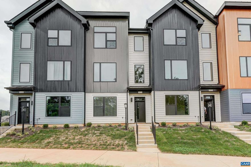 Move in ready.  Brand new townhome in the desirable Old Trail community - Walk to shops, restaurants, pool, and golf! Modern design, with energy efficient building.  You'll love the large windows, light filled rooms, low maintenance luxury vinyl flooring and  carpeted bedrooms. Quiet location overlooking green space.  The main level open floor plan features a great room with gas fireplace and shiplapped accent wall, dining area with farmhouse chandelier, and modern kitchen with white cabinets, tile backsplash and quartz countertops.   Upstairs, the primary suite features a private ensuite bathroom with frameless glass shower, and walk in closet.  Two additional bedrooms share a full bathroom, and there is a large laundry room. Washer and Dryer to be installed at tenants request. Ground floor features a fourth bedroom/home office, and full bathroom. All this and a 2 car garage too!