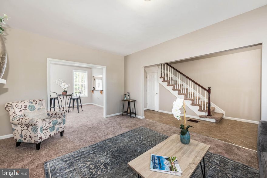 UNIQUE OPPORTUNITY TO OWN THIS SPACIOUS END OF GROUP ROWHOME WITH A DETACHED BUILDING THAT'S ZONED COMMERCIAL!  Perfect live/work opportunity or rent out the commercial garage/building to help pay your mortgage!  The main house features a spacious living room, separate dining room, galley kitchen with updated cabinets & granite counters, a convenient main level half bath, upper level Primary bedroom suite with a full bath and 2 additional bedrooms with a hall bath, an improved basement that can be used for storage or finish to add more living space, a 2nd level balcony, main level rear deck, and an inviting front porch - all perfect for relaxing!  Convenient to Mondawmin Mall, Coppin State University, & Druid Hill Park!