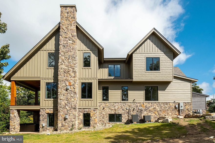 If you are looking for a stunning mountaintop home, this is it. Offering three levels of living space, an open floor plan, top-of-the-line finishes, LVT flooring and exposed beams. The spaciousness of this home and abundance of windows makes this home flow from the inside out. The location is within a few steps from chairlift #7, which affords you ski access by just walking out your door. The views are just breathtaking during any season at Deep Creek Lake. You are also within minutes of the lake, the whitewater course, restaurants, recreation and more.