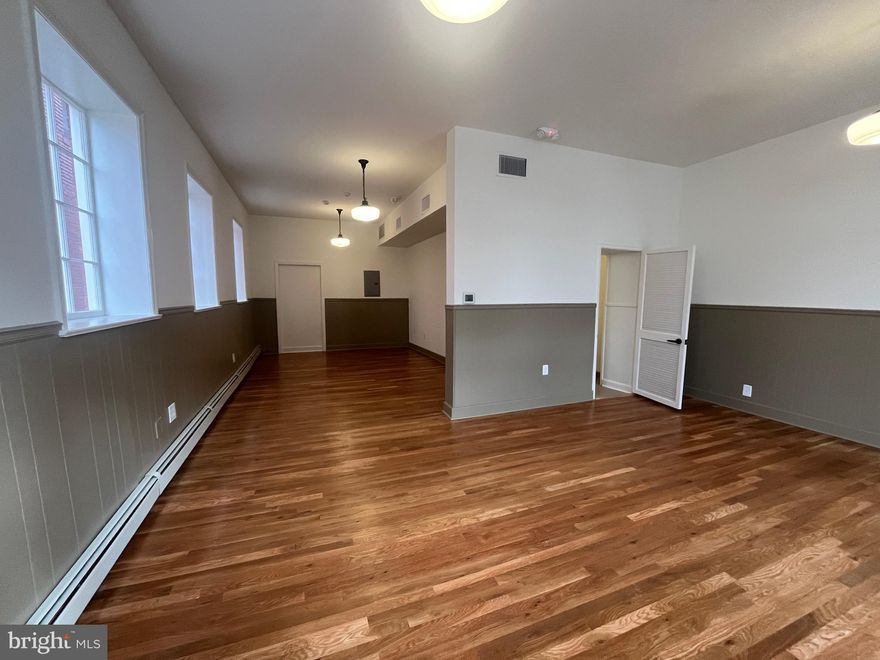 Beautifully renovated commercial suite in the heart of downtown Martinsburg. This 720 sq ft first-floor office/retail space features a large open floor plan, hardwood floors, abundant natural light, a private bathroom, and a separate office area. The suite offers private entrance access, making it ideal for professional office, boutique retail, salon, studio, counseling practice, or small business use. Located in a high-visibility downtown location with convenient access to local shops, restaurants, and business district amenities. Rent includes water, sewer, trash, and gas. Tenant responsible for electric and telecommunications.