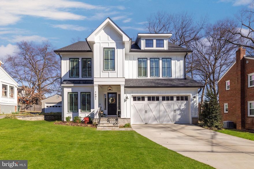 Located in desirable Cherrydale, this turnkey, semi-custom home offers three beautifully finished levels with an open and light-filled layout. Featuring crown molding, wainscoting, oak hardwood floors and plantation shutters throughout, the main level offers a sunny foyer, a flexible office/den and a formal dining room. Connecting to the dining room through the butler's pantry, the gourmet kitchen features honed granite and quartz countertops, high-end appliances and a large center island. It opens to the family room with coffered ceilings, a gas fireplace and access to the backyard. Upstairs, the primary suite offers dual walk-in closets and a luxurious primary bath with dual sinks, a freestanding tub, a separate seamless-glass shower and marble tile throughout. There is a second bedroom suite, two additional bedrooms that share a Jack and Jill bath, and a laundry room. The lower level provides an expansive recreation room with a game area, wet bar with a refrigerator and access to the backyard. There is also an additional bedroom, a bonus room and a full bath. The fully-fenced backyard features a spacious composite deck, overlooking a bluestone patio and a charming storage shed. A short walk to Washington-Liberty High School and Metro, all of the shops and restaurants of Ballston and Lee Heights are close by.