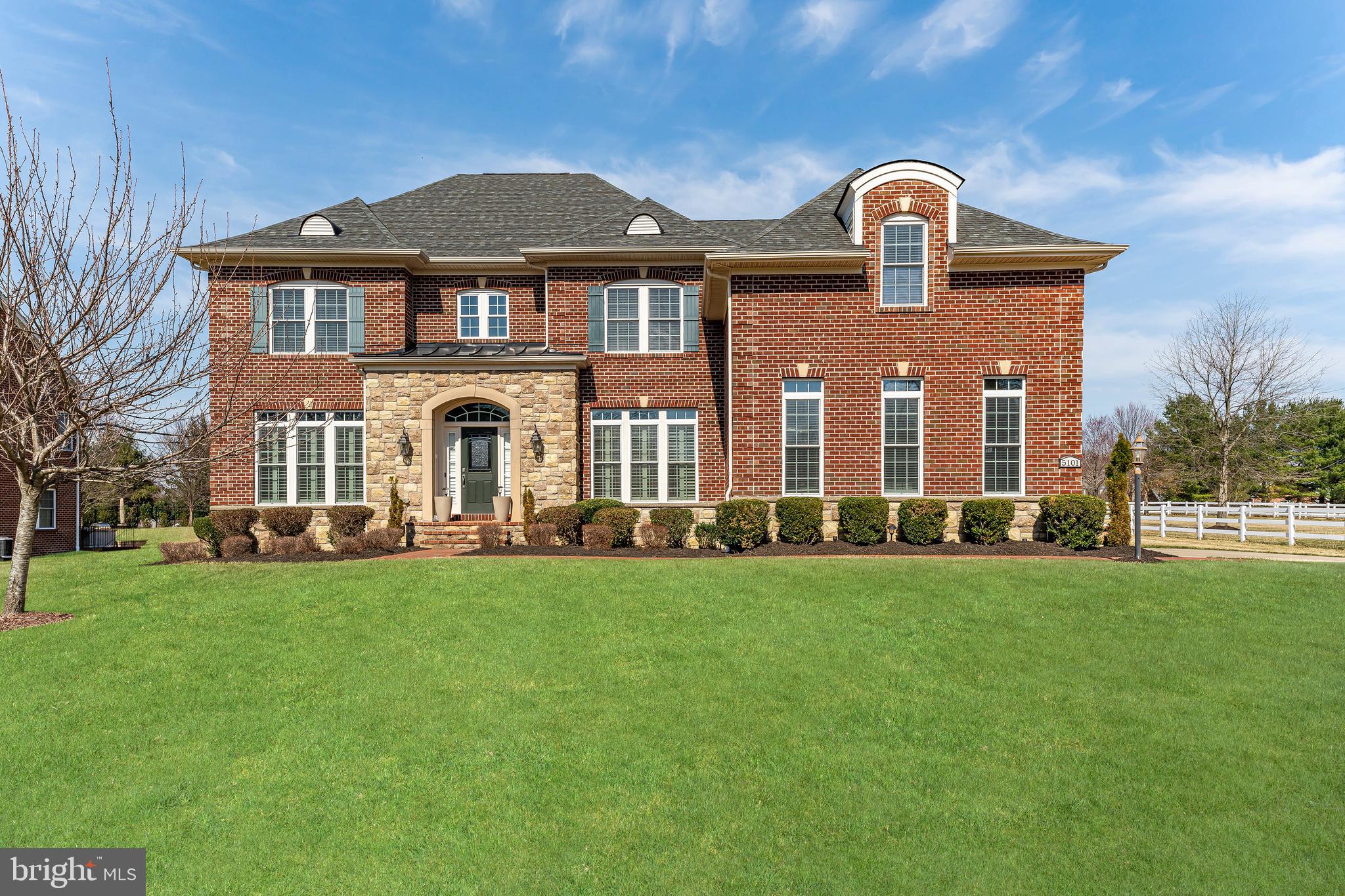 STUNNING ESTATE HOME in the prestigious Bequest of Fairwood is back on the market! Experience unparalleled luxury in this exquisite three-sided brick, three-car garage, 7,500 square foot Colonial nestled within the gated Bequest of Fairwood. From the moment you step inside, you're greeted by gleaming hardwood flooring that flows through the grand foyer, formal living room, elegant dining room, private home office, and luxury eat-in kitchen. Designed for comfort and style, the home is pre-wired for multiroom sound and offers a breathtaking two-story family room with built-ins, a fireplace, and dramatic Palladian windows that flood the space with natural light. The dining room showcases a refined tray ceiling and custom millwork, perfect for formal dinner parties. The living room features intricate crown molding, which is continued throughout the home, adding a touch of sophistication. At the heart of the home, the gourmet kitchen is a chef’s dream, boasting upgraded stainless steel appliances including a built-in, top-of-the line refrigerator, granite countertops, an expansive center island, custom backsplash, and a walk-in pantry. A coffered ceiling enhances the space, exuding timeless elegance. Adjacent to the kitchen is a sun-filled breakfast room overlooking the expansive backyard featuring a stone paver patio. The three-level patio offers multiple zones for entertaining and lounging, making it a perfect outdoor hangout. Retreat to the lavish primary suite with a refined tray ceiling, where a columned sitting area, private balcony, spa-inspired luxury bath, and a high-end custom walk-in closet create a true sanctuary.
The fully finished, walk-out basement is an entertainer’s paradise, featuring a custom-built wet bar, spacious recreation room and full bathroom. Community amenities include a private community pool, tennis courts, volleyball courts, trails, a clubhouse, and scenic parks. WINNER!