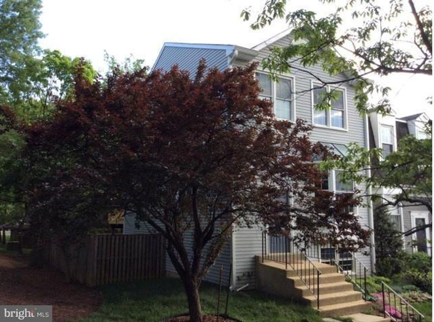 Large end unit in friendly cul-de-sac; deck is new; remodeled kitchen with high end GE Profile stainless appliances, all new custom wood cabinetry;granite counter tops, tile back splash, decorative faucet and sink; crown molding on main level; thermal pane windows and efficiency doors; Brazilian cherry hardwood throughout main level; custom window treatments. Close to NASA Goddard, great schools.