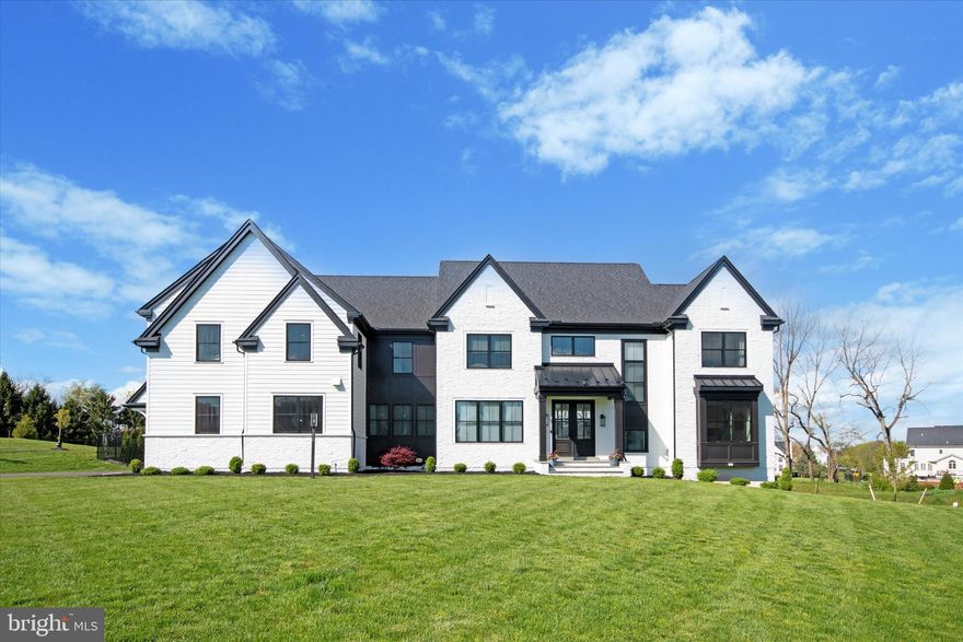 Experience luxury living at 552 Hopwood Rd in Collegeville! This exceptional property is truly one-of-a-kind, featuring an array of impressive amenities and upgrades both inside and out. A stunning expanded driveway entrance lined with Cleveland pear trees welcomes you home, complemented by landscape accent lighting that highlights the house's beauty and surrounding trees. This almost 2-year-old home is simply gorgeous. Enter through the 8 ft Mahogany double doors to a 2-story foyer. Surrounded by a balcony overlooking the 18FT living/family room area with coffered ceilings a 42-inch gas fireplace and Ceiling-to-floor windows. This open-concept area has a breakfast room and combo kitchen. Kitchen appliance includes a subzero fridge, 60 in wolf range. Super white quartz, double waterfall 11 ft island. A Kohler work sink and a bosch dishwasher and all appliances have paneled fronts. Scullery off of the kitchen, a full walk-in pantry, and a full workstation. This kitchen was designed for the chef and entertainer. Formal Dining area. Double doors lead to a home office, 2 half baths, mudroom, service doors to 3 car garage, driveway, and back yard complete this level. The main level includes 2 sets of stairs to the second-floor level and also 2 stairs to the lower level each from opposite sides of the home. The main level includes red oak stained floors in country white, doorways accented with arches. Take the entertaining out back through the 4 panel bi-fold doors. All windows throughout are Pella architectural series. The home's second level has 5 bedrooms, 3 full baths, a laundry room, and a loft. The fifth bedroom includes rough-in plumbing for an attached future full bathroom (hidden under carpet) and features an existing bathroom vent fan and lighting. All bedrooms are carpeted. The guest bedroom has a pocket door for privacy and an ensuite bath . The main bedroom has a walk-in closet with a built-in ironing board and an island. Closets by design customized this space. This room has black-out blinds, and you will find both motorized/non-motorized Hunter Douglas blinds throughout the home. The ensuite 4-piece bath, includes an elongated soaking tub, a frameless zero-entry shower with multiple shower heads. Step into the backyard oasis, where you'll find a covered patio equipped with motorized retractable Phantom screens, a cozy fireplace, and electric heaters—perfect for year-round outdoor enjoyment. Entertain effortlessly with an outdoor kitchen under a pergola, complete with a built-in grill, sink, beverage refrigerator, and bar island seating. Relax and unwind in the fiberglass pool with a sun shelf and hot tub, surrounded by a regraded backyard for flattened, usable space and a newly installed retaining wall with built-in lighting and privacy trees. The 6-foot black aluminum fence ensures privacy and security, while the raised bed garden with white river rock adds charm and functionality. Enjoy lush Waltz Turf Farm Kentucky bluegrass sod and the convenience of a 6-zone sprinkler system exclusively for the backyard, along with two hydrants for tree drip lines and garden watering. The 3- garage features an epoxy floor, enhanced with cabinets and wall paneling. This meticulously designed property also offers a finished basement prep package with 9-foot  foundation walls, underground plumbing rough-ins for a future full bathroom, and HVAC capacity for a future finished basement. Located in a desirable Collegeville neighborhood with easy access to major roads, shopping centers, and recreational facilities, This home offers the ultimate in luxury living.   Many more additional amenities and upgrades to see.