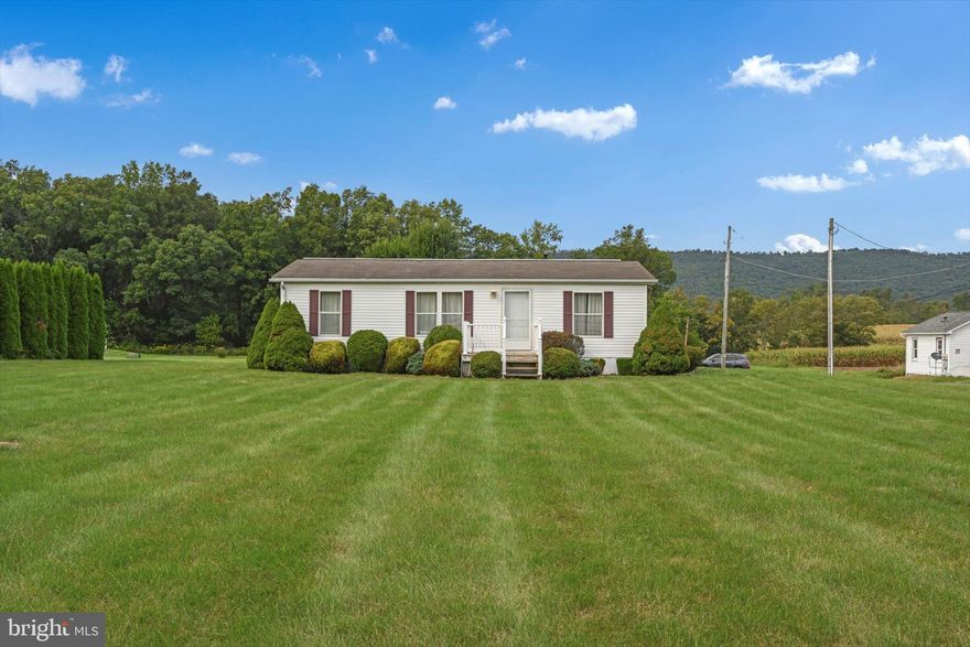 True one story living in a picturesque country setting! This well-maintained manufactured home is just waiting for its new owner.  Situated on just shy of an acre, you can relax and enjoy the views from the back deck and more than enough yard space for picnics, kickball, or perfecting your green thumb!  The home itself boasts 3 Bedrooms and 2 full Baths. The master suite features its own Bathroom with walk-in closet.  Upon entering you'll be greeted by the laundry area with washer and dryer;  eat-in Kitchen which includes all appliances as well as ample cabinetry; and spacious Living Room.  Central air, oil heat, 200amp electric, public water, onsite septic.  Plenty of off-street parking as the paved driveway can fit 4+ vehicles. The 10x14 shed is included for storing your mower and other lawn necessities.  This one isn't going to last long so schedule your showing today! 
 
Listing agent related to owner.