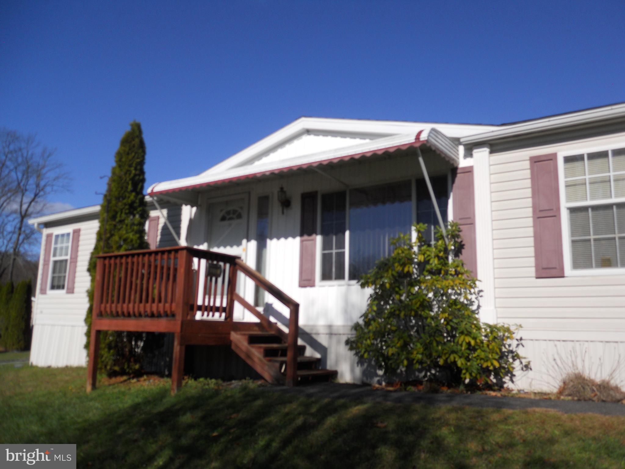 Enjoy one floor living in Heister's Creek. 3 bedroom 2 full bath that features a spacious family room with a fireplace with a wood insert. Dining area with door to small deck. All bedrooms feature walk in closets. Roof approx 5 years old, Gas heat and hot water. 2 exterior sheds. Lot rent is $375/month that includes trash removal. Won't last long.