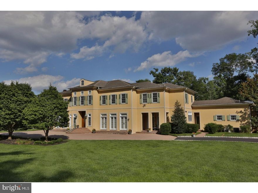 This Pennock Woods Estate is a triumph of the 21st Century, modeled after the French Manor Homes of the 15th and 16th centuries. Beautifully situated on a corner lot, the symmetry of the classical facade has a commanding presence at the intersection of Stocton and Herkness Roads. This home offers impeccable architectural design and extensive detailed millwork throughout. The foyer opens to the Living and Dining rooms, looking forward is the magnificent grand staircase hall. There is a gallery that runs the axis of the main floor that adds to the effortless flow for entertaining on grand or intimate occasions. A sitting room/office and a library with handsome built-in bookcases on the east wing that have multiple sets of French Doors that access the rear terrace. The second floor gallery overlooks the 2 story family room with fireplace,oak bookcases and built in bar. The mammoth kitchen is wonderful for caterers or the home chef - classic white cabinets with 2 islands and granite counters, appliances include built in refrigerator, 2 dishwashers, Viking 6 burner cooktop, double ovens and warming drawer. The Kitchen has a light filled breakfast area with access to the terrace through French doors. The mudroom off the kitchen leads to the 3 car garage with radiant heated floors the laundry room, powder room and the In-law/Au pair suite accessed by separate staircase. The in-law suite is a home unto itself with a full kitchen, full bath, eating area, sleeping area and living space. The 2nd floor features an enormous master suite, containing a lovely dressing room with 2 walk-in closets, a luxurious en-suite marble bath and a sun drenched bedroom with fireplace and sitting area. There are 3 more bedroom suites each with its own bath and walk-in closets. The master bedroom and staircase hall access the 2nd floor balcony that overlooks the beautifully maintained landscape. The finished Basement with almost 2000 sq feet of space includes a bar, kitchen, full bath as well as a pool table area, movie viewing area and room for a dance floor. The impeccable mechanicals offer the comfort of 7 zones of radiant floor heating as well as 6 zones for the central air conditioning. This is truly one of the most elegant newer homes being offered in Meadowbrook's most prestigious neighborhood.