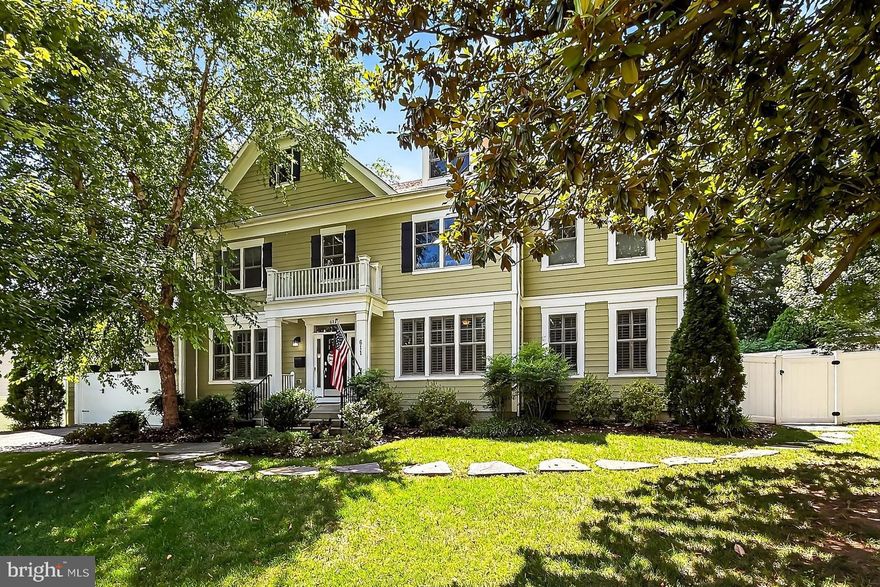 You’ve found your new Falls Church City house in this stunning and quality-built custom home nestled at the end of an Oak Haven cul-de-sac. Contemporary design blends with classic colonial living making this home great for entertaining but also loaded with features for real life living – aka lots of storage! This spacious 5,000+ sf home features 5BR/4.5BA in an airy and open concept layout. The main level has hardwood flooring with a two-story entry foyer, large dining room, Eat-in Kitchen w/a breakfast bar/stainless appliances/granite countertops/pantry which is open to the Living Room w/gas fireplace & ceiling fan. This floor also has another open gathering space with doors to the spacious backyard and patio/deck, an ensuite guest bedroom, office, wine bar, mudroom with double closets, and a half bath. The second floor has the large master suite with a bedroom, sitting room, huge custom closet, double linen closets, and bathroom with a double size shower and large soaking tub. The other three bedrooms have a shared hallway bathroom and one ensuite bathroom. There is another large open loft area for great versatile space. The Laundry room is also on the second floor. The fully fenced backyard has a huge patio, built in 2023 and surrounded by a lush landscape highlighted at night with integrated lighting. Other features include Elfa storage and closet systems, solid wood doors w/custom moldings, plantation shutters and window coverings, 4 large wall mounted TVs which convey, a 17KW home generator, and an electric car charging station. Also, the house sits atop a full crawl space basement which adds over 2000sf of storage. All of this and more convenient to the Metro, W & OD Trail, FCC farmers market, parks, and the highly rated Falls Church City schools. This home is a gem and you know what they say, location, location, location and this house has it in spades…