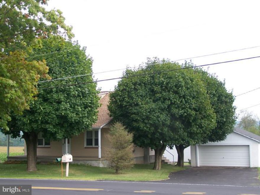 Charming farmette in Southern Lehigh School District.  Meticulously maintained.  Lower Milford Township cape on 1.5 acres surrounded by fields.  Longtime owner has lovingly updated this home with new roof, new siding, new windows, newer kitchen and flooring throughout the home.  1st floor master bedroom with adjacent full bath.  Open & airy first floor living & dining room & kitchen.  2nd floor features 2 large bedrooms and a large storage room that could be an additional bedroom.  Walk-up attic.  Full walkout basement.  Large 2-car garage.  Large shed & small barn with stalls & convenient water pump.  Great location!  Come see it today!