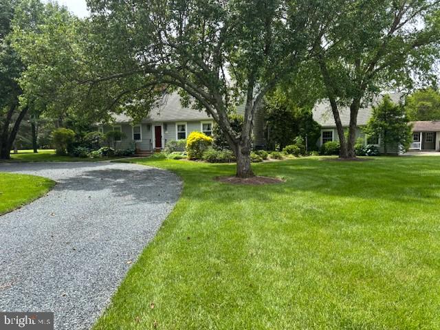 This charming Cape Cod is located on a beautifully landscaped 2 acre lot. Old trees, gardens and beautiful lawn. First floor features living room, nice kitchen with woodburning fireplace and dining area, sunroom, primary suite, laundry/mud room and half bath. The 2nd floor features 2 nice size bedrooms, full bath and spacious attic/storage. Detached 2-car garage and big deck. Close to Oxford and Easton amenities.