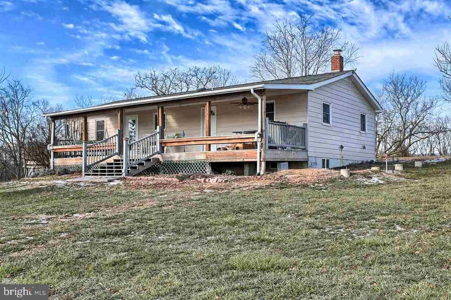 Lovingly cared for home on 10.8 acres, 5 fenced paddocks, two outbuildings with water and power. Enough space to raise animals or cultivate crops. The kitchen features butcher block counters and is open to the living room where you can stay cozy next to the wood stove.  The lower level has a family room, a bedroom, and a bathroom with a jetted tub to relax in. This beautiful home also has a workshop, a canning room, and 2 decks.