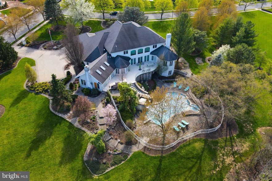 Fabulous 7,130 Sq. Ft. custom contemporary built by Posocco is situated on a beautiful 1.58 acre treelined lot in the Parkland School District & is located in Trexler Estates backing up to the golf course. 1st flr has a large 2 story entry foyer, sunken LR w/19 Ft. ceiling, sunken DR w/tray ceiling, huge MBR suite w/bamboo flooring & full bath w/steam shower & skylights, spacious office, chefs kitchen w/granite counter, electronic spice rack & top of the line appliances, butlers pantry, family rm w/wood burning FP & media built-in, laundry rm & 2 half baths. 2nd flr has a catwalk overlooking the foyer & LR w/4 large ensuite BR's. The lower level offers 3,300 Sq. Ft of added living space w/open concept recreation rooms, 2 BR's, full bath, gym & potential home theater. Impressive floating Italian tile patio w/glass panel railing, outdoor kitchen w/granite top & Lynx appliance & stone staircase leading to an amazing heated pool w/waterfall & spa. 3 car garage w/paver driveway & walk way.
