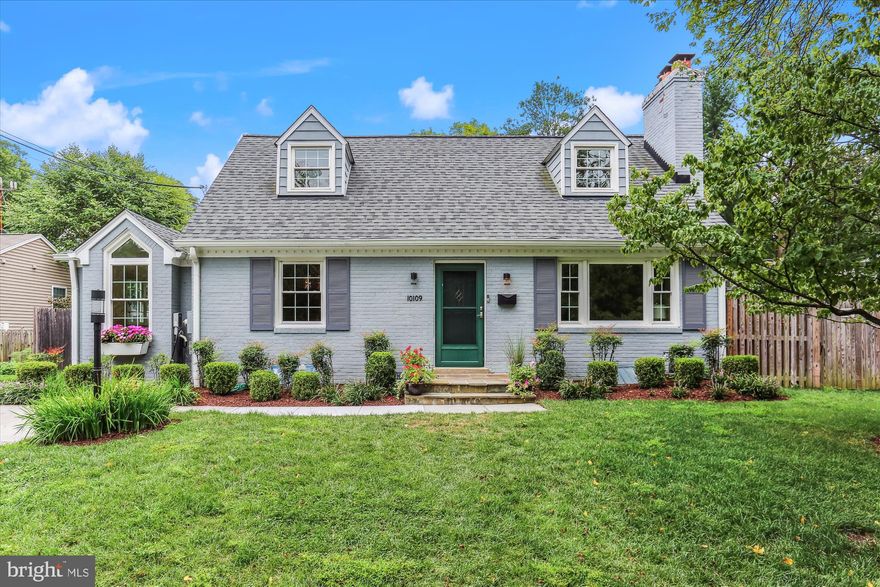 Located along the quiet, tree-lined frontage road of Kensington Parkway, this charming Cape Cod home enjoys serene views of mature trees from the front while remaining just a short stroll from all that Kensington has to offer.

Featuring four bedrooms and three bathrooms, the home offers the flexibility of one-level living with a main-floor bedroom and a beautifully renovated full bath with a glass-enclosed shower and stylish vanity. Upstairs, you’ll find three additional bedrooms and another updated full bath.

The kitchen, complete with brand-new appliances, opens to a cozy family room with backyard access—perfect for both daily living and entertaining. The inviting living room showcases a gas fireplace with built-in shelving, while the separate dining room provides space for gatherings. A versatile main-level bedroom doubles as a den and connects to a bright office or playroom.

The finished lower level with luxury vinyl plank flooring expands the living space, offering a recreation room with a wood-burning fireplace and built-ins, a half bath, an exercise room or office, laundry, ample storage (with shelving that conveys), and convenient walk-out access. The fenced backyard is a true highlight—featuring a lovely patio and a storage shed. Refinished hardwood floors flow across the main and upper levels, complemented by a freshly repainted interior for a crisp, updated feel.

Important updates include: HVAC, hot water heater, and roof (2015–2016), all new exterior doors and windows (2013), new sump pump (2023), and replacement of the laundry room pipe to the street (2022). A newer washer and dryer convey, and the driveway with EV charger provides convenient off-street parking.

The Community:
Kensington is beloved for its small-town charm, vibrant community life, and excellent public schools. Residents enjoy neighborhood parks—including one right across the street—as well as nearby Rock Creek Park for hiking, biking, and outdoor recreation. The historic district offers Victorian-era architecture, unique shops, and a popular weekly farmers market. Annual events such as the Day of the Book Festival, summer concerts, and a Fourth of July bike parade create a lively and welcoming atmosphere.