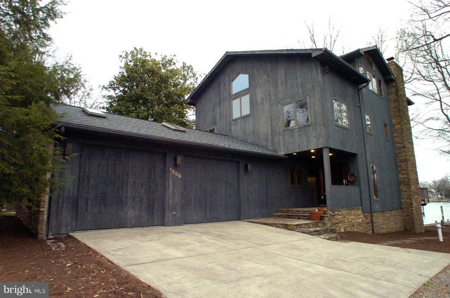 BACK ON THE MARKET! BUYERS FINANCING FELL THROUGH. Waterfront property. 50 ft footage w/ private dock & boat lift. New roof, newer 2 zones HVAC, new well, refinished wood floors, new carpet on 2 flr and huge loft. Large kitchen with island, bay window, 2 wood fire places one in the master bedroom. Floor to ceiling windows. 1st floor and master bedroom decks over looking Oyster Creek.