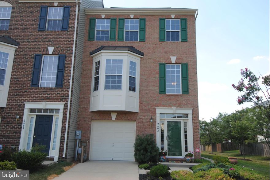 "Wow" Town Home with garage...Designer features throughout this three bedroom two and a half bath show place...End of group and backing to open space.  Three fully finished levels each with bump outs adding even more space...Open floor plan.  Owner suite has sitting area and has custom closet...Amazing hardwoods...Piney orchard amenities...Three HoA's that total $153 per month...Shows like a model