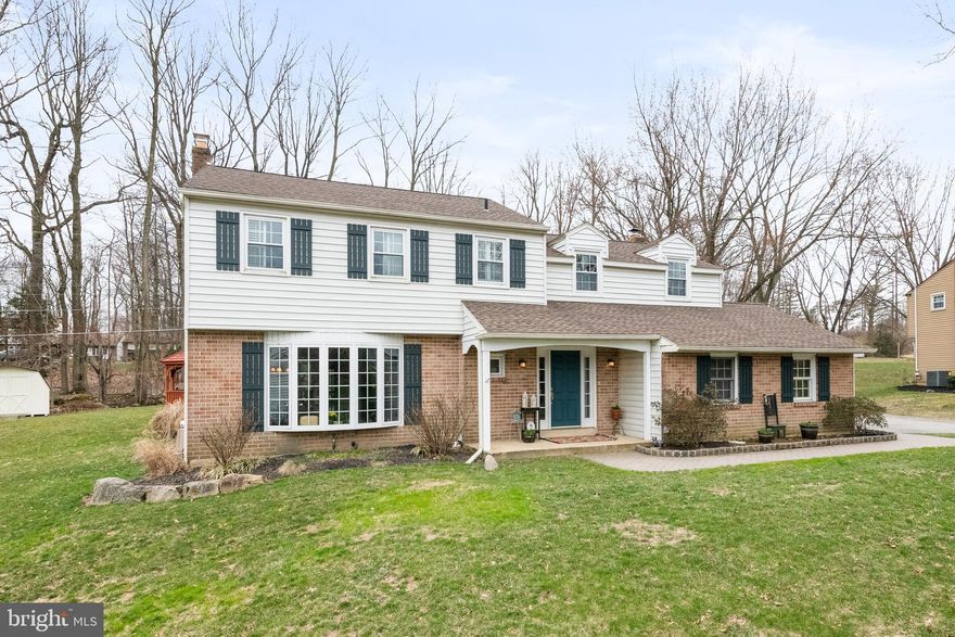 Welcome to this fully updated Colonial in the desirable Marchwood neighborhood.  This beautiful home wows as soon as you walk through the front door and enter the foyer with renovated stairway.  The 4 bedroom, 2.1 bath home features brand new laminate wood floors and fresh paint throughout.  The living room is situated to the left and flows into the dining room.  The large bay window in the living room and sliding door leading to the deck in the dining room bathe the rooms in natural light.  The eat-in kitchen has custom cherry cabinets, new quartz countertops, new backsplash, new dishwasher, and new microwave.  The beautiful laminate wood floors continue into the family room with wood burning brick fireplace and French doors leading to the great room.  The great room is awash in natural light from windows overlooking the backyard, French doors leading to the patio/deck, and access door from the side.  The separate office can be accessed from a private side entrance.  The powder room finishes off the main level.  The upper level continues with gleaming hardwood floors in the hallway and into the master suite.  The master suite was renovated with step-in closet, plantation shutters, and fully updated master bath with tiled shower and floor.  There are three additional nice sized bedrooms - two carpeted and one with laminate wood floors.  The hall bath and laundry closet have been fully renovated and finish off the upper level.  The flat backyard with deck, patio, and gazebo creates a great atmosphere for entertaining and relaxing.  This beautiful home is ready to be enjoyed.  New roof with 50 year warranty in 2014, new gutters, downspouts and gutter guard in 2014, new water heater in 2016. Make your appointment today; it won't last