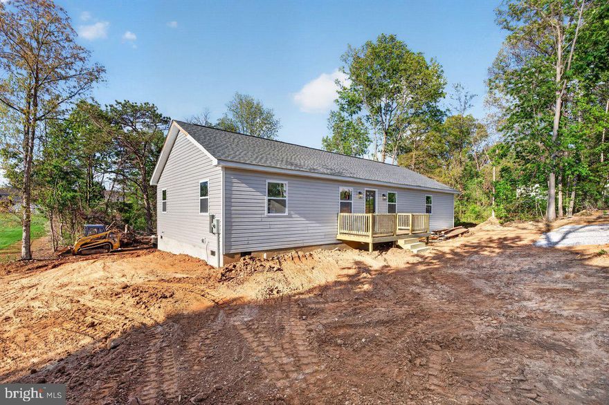 This 4-bedroom, 2-bath home offers contemporary, low-maintenance living with stylish details. The kitchen showcases butcher block countertops and white kitchen cabinets, bringing warmth and brightness to the heart of the home. Luxury vinyl plank flooring runs throughout, providing durability and a seamless look from room to room. With completion near, this home presents a fantastic opportunity to move into a crisp, modern space crafted for comfort and daily living.