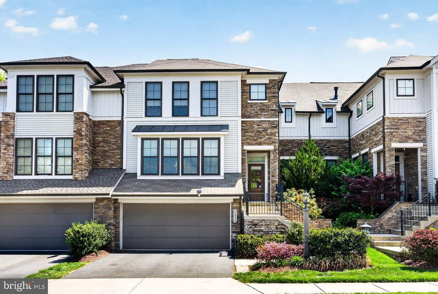 If you’ve been waiting for a home that truly stands out—this is it!

A beautifully appointed townhouse offering an elevated living experience, anchored by a stunning kitchen designed to impress. The home’s exceptional flow is immediately evident, highlighted by a raised family room that creates both visual interest and an ideal setting for entertaining. The kitchen serves as the heart of the home, seamlessly connecting to the surrounding living spaces.

Rich hardwood flooring extends throughout, with additional hardwood beneath the existing carpet, offering both warmth and future flexibility. Hunter Douglas window treatments are featured throughout, adding a refined and cohesive finish.

Indoor living transitions effortlessly to the outdoors with a screened-in porch enclosed by sliding glass doors, creating a true three-season retreat. The space below is also fully screened, allowing for comfortable outdoor enjoyment without interruption. A covered patio and fenced backyard backing to a private, wooded setting—complete with an automatic dog door—further enhance the home’s livability and convenience.

Major systems have been thoughtfully maintained and updated, including brand-new front-facing windows, HVAC ( 10 years for heat /  3 years for AC), a  12-year roof, and a  10-year water heater, along with a brand-new kitchen faucet and garbage disposal—providing peace of mind for years to come.

Ideally located just moments from Brambleton Town Center, residents enjoy easy access to dining, shopping, fitness, and entertainment. The community HOA offers a true low-maintenance lifestyle, including lawn care, snow removal, trash service, and access to five pools, all within a highly sought-after school district.

Designed to be the obvious choice, this home offers a rare combination of thoughtful upgrades, effortless flow, and a lifestyle defined by convenience, comfort, and elevated living.