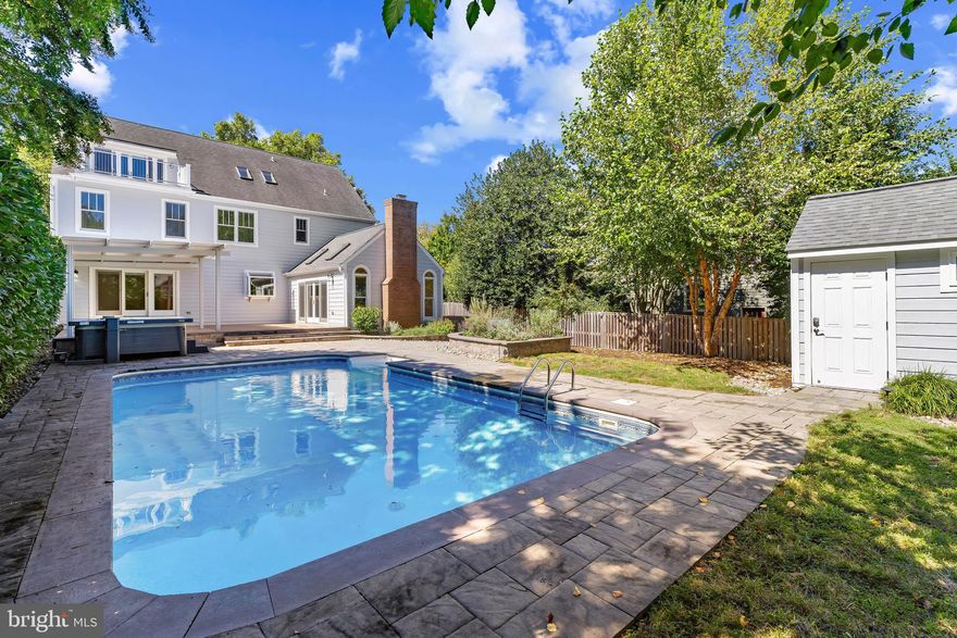 Perfectly sited on over a quarter-acre gated lot on Second Street, this meticulously maintained Eastport estate offers 4,500+ square feet of luxurious living space and extensive oak flooring in one of Annapolis’ most coveted neighborhoods. Enjoy the tranquility of suburban-style privacy with the walkability of downtown living - just steps to water access, acclaimed restaurants, shopping, and marina life.

Inside, generous proportions define the main level. A spacious living room and elegant formal dining room open to the expansive deck and pool area, while a chef’s kitchen boasts a quartzite island, high-end appliances, and a casual eat-in space. The main level also features an updated laundry room, chic powder room, and a dramatic family room with vaulted wood ceilings, gas fireplace, and sliding doors to the outdoor oasis.

Upstairs, the serene primary suite features vaulted ceilings, a walk-in closet, and a spa-inspired bath with heated floors, a rainfall shower, double vanity, and heated towel rack. Three additional oversized bedrooms and a stylish hall bath complete the second floor. The third level offers breathtaking views of Historic Annapolis and the Naval Academy from the rooftop balcony - perfect for fireworks or Blue Angel flyovers - and includes a family room, kitchenette, full bath, and bedroom.

The fully finished lower level is made for entertaining, with a rec room, custom bar (complete with kegerator and refrigerated drawers),  a flexible bonus room ideal for a wine cellar or storage, and a workshop.

Step outside to your private resort: a heated in-ground pool and spa with motorized cover, a pergola with adjustable louvers, lush landscaping, and a park-like front yard. Additional features include Hardie siding, composite decking, updated windows and gutters (all completed in 2019), a two-car garage, and a gated driveway.

This is a rare Eastport offering where timeless elegance, thoughtful updates, and premier location come together. Welcome Home!