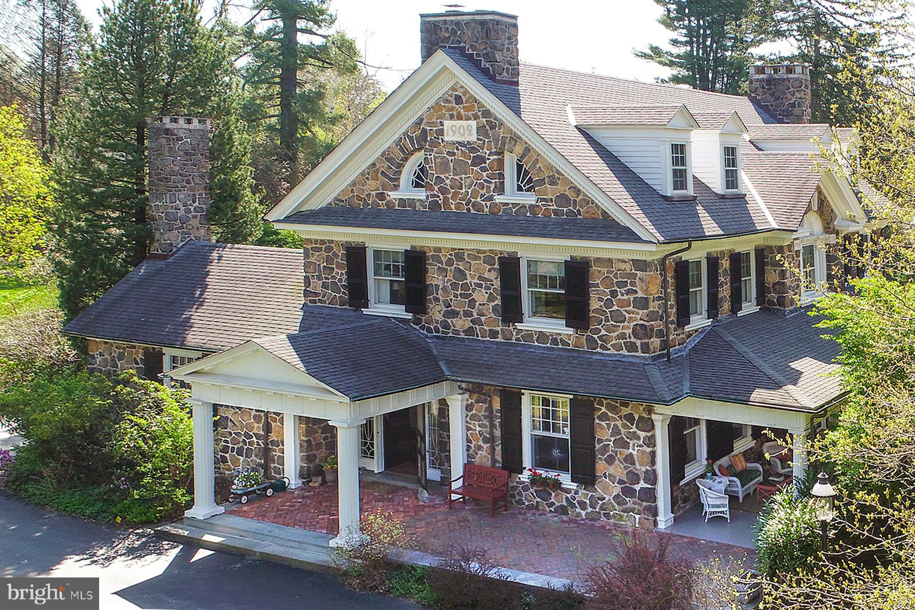 A once-in-a-lifetime opportunity to live in a home designed by the same man responsible for Appleford and the restoration of the Betsy Ross House. This spectacular home was designed by R. Brognard Okie in 1902. Enter into the impressive center hall with a dramatic staircase, on the landing an inviting window seat with an exquisite Palladium window. First floor includes the Library, Front Parlor and connected Sitting/Music Room, Formal Dining Room, Powder Room, Coat Room, Kitchen, Laundry Room, and a bonus room that is currently being used as an Office but has also been a Crafts Studio and a Homework Study. There are 6 fireplaces in this magnificent home, 4 of which are on the first floor with one in the charming inglenook with seating and cupboards under the stairs! Three first floor fireplaces are gas fueled. There is also a separate Suite located on the first floor with its own entrance that is fully handicap accessible and has an additional second floor bedroom. With exquisite moldings throughout, everything in this home has been appreciated and preserved by the families that have lived here. Okie's love of woodwork and his clever design style is truly showcased in this Colonial Revival masterpiece, full of light-filled rooms and nooks and crannies (to the delight of the young ones who have enjoyed this wonderful home). With over 7,000 square feet of living space, 8 bedrooms, 4 full bathrooms and 1 half bathroom, this world-class property is a rare piece of Main Line history. Oversized 2 car garage with staircase access to large unfinished space above. Could be finished into a great workspace or studio. Set on 2.9 acres of glorious grounds with a private swimming pool in Pennsylvania's #1 School District, Tredyffrin-Easttown.