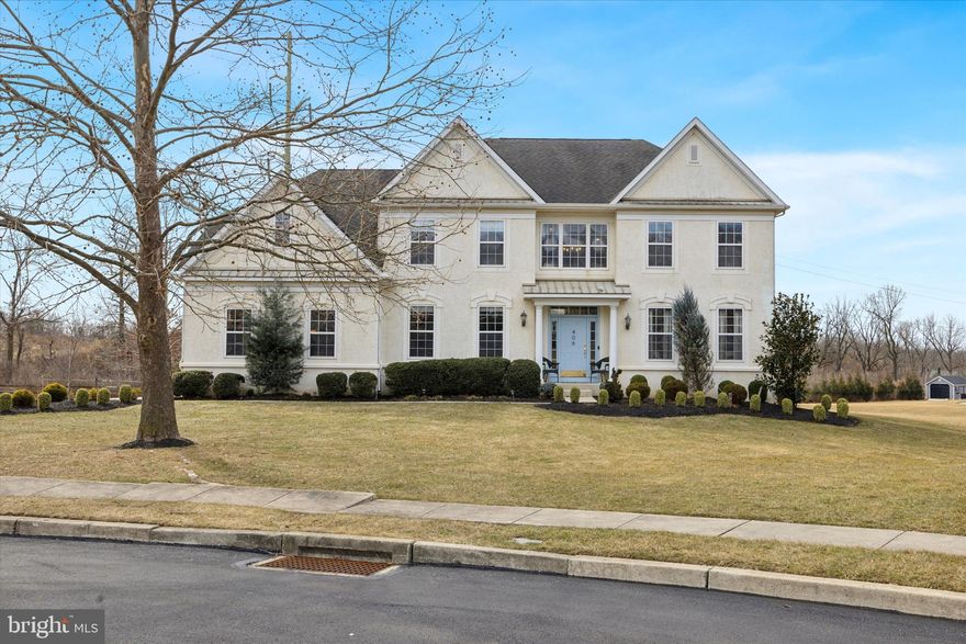 Experience the best of suburban luxury in this beautifully maintained Colonial home, nestled in prestigious Wainwright at Whitemarsh. From the moment you pull into the driveway and stroll down the walkway, you’ll feel right at home. The inviting curb appeal, complete with a well-manicured lawn, sets the stage for what’s inside. Step through the portico entrance into a grand foyer, where gleaming hardwood floors flow throughout the main level. To the right, a formal living room offers a sophisticated space for relaxing, while a formal dining room with elegant wainscoting provides the perfect setting for hosting dinners and gatherings. The spacious family room features soaring ceilings, plush carpeting, bright windows, and a cozy fireplace. A back staircase leads to the upper level, adding both charm and convenience. Adjacent is the fully equipped chef’s kitchen, designed for both function and style. Highlights include top-of-the-line stainless steel appliances, ample cabinetry, a large center island with bar seating, and a built-in workspace. There's also a table space, ideal for casual meals. From here, a sliding glass door opens to the back deck equipped with a retractable awning, offering a serene view of the backyard—great for summer BBQs. Also on this level, you’ll find a bright home office with built-in shelving, a pristine powder room, and a laundry room for added convenience. Head upstairs through the elegant front staircase, where the hallway overlooks the family room below. The expansive primary suite is a true retreat, featuring a large walk-in closet, seating area, gas fireplace and a built-in vanity, ideal for reading or journaling. The ensuite bathroom blends style and function, featuring a soaking tub, glass-enclosed shower, and separate his-and-hers vanities. The second level also offers three additional, generously sized bedrooms, each fully carpeted, filled with natural light, and equipped with built-in closets. A large hallway bathroom with a dual vanity completes this floor. The finished basement offers versatile living space. It includes a gym room, powder room, a cozy den, a wet bar with seating, and an expansive open area perfect for recreation—whether you envision a game room, media space, or anything else to fit your needs. Located at the bottom of the cul-de-sac, parking is a breeze with a two-car garage, a long driveway and plenty of quiet street parking, great for large gatherings. Located within the award-winning Colonial School District and the highly desirable Ridge Park Elementary School zone, this home offers easy access to major roadways, public transportation, shopping, dining, and more. Don’t miss your chance to make 406 Brice Lane your dream home!