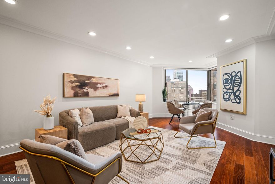 Experience the pinnacle of refined city living in this elegant 2 bedroom, 2.5 bath residence at the iconic Rittenhouse Hotel, situated on Rittenhouse Square. This rare offering showcases spectacular Park views from every window and seamless access to five-star hotel amenities, blending privacy with premier service. A wide, welcoming entry introduces a thoughtfully designed layout. The expansive living room features rich hardwood floors, recessed lighting, and French doors that provide flexibility to use the adjoining second bedroom as a den, office, or guest space. The gourmet kitchen is outfitted with cherry cabinetry, paneled refrigerator, an oven and microwave/convection oven, dual sinks, and a breakfast bar ideal for casual dining or entertaining. Both bedrooms are ensuite and generously sized. The primary suite includes a serene sitting area with views of the Square, a custom oversized walk-in closet, and a spa-like bath with dual vanities, jacuzzi tub, separate shower, and a laundry closet. The second bedroom easily accommodates both a sleeping and work area. Residents of The Rittenhouse enjoy access to an exceptional suite of services, 24-hour concierge, room service, housekeeping & laundry, Chauffeur-driven Mercedes sedan, Health club, indoor pool, steam room & sauna (membership required), Paul Labrecque Salon & Spa, On-site dining at Lacroix, Scarpetta, and The Library Bar.  Valet parking is available for a monthly fee.  Just outside your door, enjoy the vibrant culture and serenity of Rittenhouse Square, surrounded by Philadelphia’s finest restaurants, boutiques, and cultural attractions. Whether enjoying a morning stroll through the park, an evening at a top-tier restaurant, or the tranquility of your private residence above it all, this home is a rare find that perfectly balances luxury, location, and lifestyle.