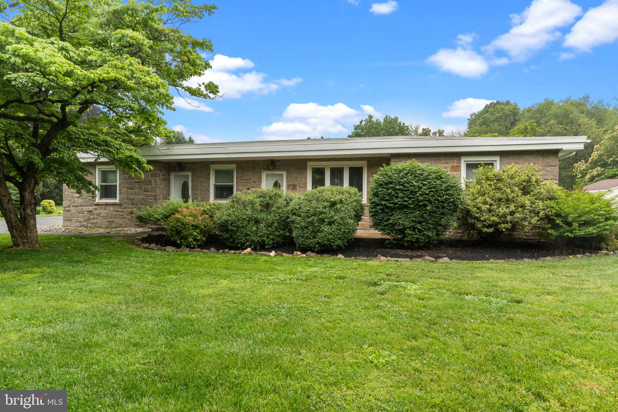 Welcome to this beautifully updated 5-bedroom, 3 full bath ranch style home, in the desirable Garnet Valley School District, where comfort, charm, and functionality come together in perfect harmony. From the moment you arrive, you’ll appreciate the classic curb appeal, with a low-maintenance exterior of stone and stucco that offers both durability and timeless style.
Step inside to discover a well-maintained, thoughtfully updated interior filled with natural light and elegant details. The main kitchen is a chef’s dream, featuring a large center island, double ovens that include a multi-function microwave, and split oven, recessed and pendant lighting, and a convenient wet bar complete with a wine fridge and ice machine—ideal for entertaining or everyday enjoyment.
Just off the kitchen, the all-season sunroom offers year-round relaxation with its own mini split and ceiling fan, providing a perfect spot to unwind while overlooking the lush, tree-lined 2-acre backyard.
The spacious primary bedroom suite includes a walk-in closet, a recently updated spa-inspired bath with white subway tile, an accent wall tiled shower enclosed in glass, a double vanity with granite countertops that are all designed for functionality and relaxation.
On the opposite side of the house joined by a family room, there are three bedrooms (or two bedrooms and an office) with a large upgraded bathroom featuring a glass enclosed shower, freestanding soaking tub, dual vanities topped with sparkling granite countertops, rich smokey gray glass subway tile, and soft blue walls that create a peaceful retreat.
Downstairs, the full, partially finished basement expands your living options even further with a full size living room, a large bedroom and full bathroom and tons of storage. There is also a second kitchen area ready for your appliances, with kitchen cabinets, a sink and an island with butcher block countertops for durability. With its rustic loft feel and double doors that lead up to the backyard this space is ideal for guests, extended family, or recreation.
Step outside to a backyard made for entertaining and play. The expansive patio features a built-in brick wall, a cozy fire pit, and a charming pergola. A bridge over the basement steps leads to the kitchen side of the house and another concrete patio. A dedicated play area with a rubber mulch bed and neat edging ensures fun for the whole family, while the mature trees, beautiful gardens and meticulous landscaping provide beauty, privacy, and tranquility.
Car lovers and hobbyists will love the 40 x 60 Pole barn with 3 overhead doors, a side entry door, electricity and a loft with full sized stair access for additional storage. A separate one-car detached garage adds even more versatility.
With two long driveways—one on each side of the property—you’ll never run out of parking for guests, RVs, or gatherings.
This home truly has it all—stylish updates, generous space, and incredible outdoor living. Don’t miss the opportunity to make it yours!
