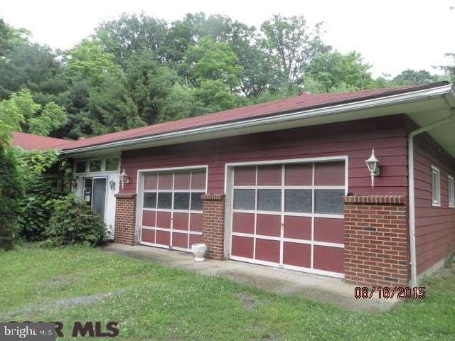 Close to town but hidden away in a private setting, this ranch home is located on an acre lot with plenty of space to enjoy. This home has an eat-in kitchen, living room with hardwood floors & fireplace, a full bath, and three nice sized bedrooms. Property is being sold as-is, where is and seller does not warranty the property condition. NO SELLERS DISCLOSURE. Buyer is responsible to verify all information. Additional addendum will be required once offer is accepted. Preferred financing for property is CASH or REHAB LOAN. All offers must include proof of funds or pre-approved.