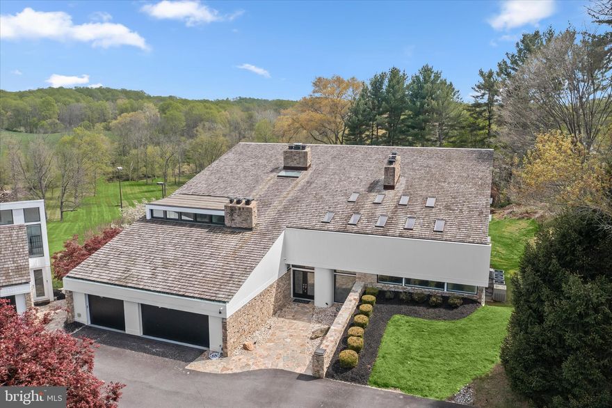 Extraordinary estate living on 6 private acres in the vibrant community; Farside. This one-of-a-kind contemporary in Ellicott City offers over 10,500 finished square feet of resort-style amenities, extensive 2026 renovations, and breathtaking valley views. With 6 bedrooms, 8 full baths, 2 half baths, and three fully equipped kitchens, this residence is designed for luxurious everyday living, multigenerational flexibility, and grand-scale entertaining. A dramatic two-story foyer welcomes you with marble and hardwood floors, a striking stone wall, and a cascading chandelier. The main level showcases expansive living and dining spaces with 6 fireplaces, a beautifully updated kitchen with new appliances, commanding center island, garden window, and breakfast area opening to a wrap-around deck. The adjoining family room features new windows and Anderson slider doors overlooking the indoor heated pool. A main-level en-suite primary bedroom with private deck and fully renovated bath offers ideal convenience.  The upper-level primary suite is a luxury retreat featuring new hardwood floors, loft, sitting room with fireplace, a fully renovated spa-inspired bath with freestanding tub, wellness room, dual walk-in closets, skylights, and private deck. Secondary bedrooms include updated hardwood flooring and beautifully appointed Italian-designed baths. The fully finished lower levels (two) deliver unmatched amenities, including a second kitchen, expansive recreation room with fireplace, sauna, steam room, billiards room, exercise room, and a full indoor sports court for basketball, racquetball, or pickleball. The spectacular pool solarium is a true showpiece with a heated indoor pool, two changing rooms, multiple toilets, vanities, shower, and new pool systems.  Extensive recent upgrades include new hardwood flooring (2025-2026), new carpet and paint (2026), new HVAC systems, water heaters, Andersen windows, updated lighting, and more. Six wood-burning fireplaces and six HVAC systems add comfort and efficiency. Outdoor living is equally impressive with a resurfaced circular driveway, new cedar siding, stone walkways, stone patios and stairs, multiple decks, fire pit, and mature flowering cherry trees perfectly sited and presiding over a serene, tree-fringed valley.  A detached garage with a spacious office, conditioned storage, an upper-level guest house with a brand new third kitchen, full bath, new flooring, and stainless appliances. Ideal for guests, au pair, or private workspace the guest house offers flexibility, hospitality and endless lifestyle options. This is a rare opportunity to own a truly distinctive estate blending privacy, luxury, and resort-caliber amenities in an exceptional Howard County setting near great schools, shopping and outdoor activities. Come home to a very special place to live, work, play and thrive!