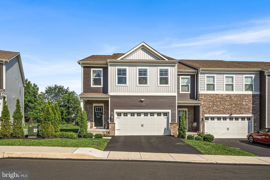 Welcome to 43 Hummingbird Lane, a stunning end-unit townhome in the award winning Spring-Ford School District within the Providence Landing community. Built just three years ago, this spacious home was the model unit and features every available upgrade. It offers 4 bedrooms, 2.5 bathrooms, and an impressive 2,877 square feet of living space. Enjoy the convenience of a private driveway and a 2-car front-entry finished garage, providing ample parking. As you step inside, you’ll be greeted by neutral tones, luxury vinyl plank flooring, recessed lighting, and an abundance of natural light that flows throughout the home. The open-concept design seamlessly connects the dining area, living room, and kitchen—creating the perfect space for everyday living and entertaining. The chef’s kitchen is a standout, featuring a large bar island, stainless steel appliances, gas cooking, a pull-down faucet, garbage disposal, soft-close cabinetry, a spacious pantry, and sleek, modern finishes. Just off the kitchen, step outside to your expansive Trex deck, complete with convenient stairs, perfect for outdoor entertaining and relaxation. A stylish half bath is also located on this level for guests. Upstairs, the owner’s suite is a true retreat, offering a walk-in closet and an en-suite bathroom with dual sinks and a stand-in shower. Three additional generously sized bedrooms share a well-appointed full bathroom with dual sinks—ideal for family or guests. The finished lower level provides a versatile flex space, perfect for a home office, media room, gym, or additional living area. It features angled ceilings, recessed lighting, cozy carpeting, and abundant storage. Additional highlights include a sprinkler system, upgraded AC blower motor, and low-maintenance living thanks to the HOA. Don’t miss your chance to own this beautifully upgraded home in a prime location—schedule your tour today!