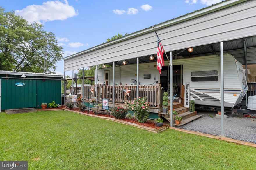 Get Excited about this one! Welcome to your vacation home away from home located at Block 18 Lot 38 Hollow Log in Riverbends seasonal campground, open April 1 - November 1 .  

Very well taken care of40 Ft 2007  Wildwood camper with a nice spacious patio area to host friends and family with a large gazebo and sweet fireplace and pavilion on SEWER  (No pump outs) and at this location you are close to all the fun and far enough away for peace. Sit on your deck or patio and enjoy camping living. All the amenities are included in the yearly dues of $1,525. Shed, fireplace, gazebo all convey.

12 Miles of deep water on the Potomac River access for boating, fishing & swimming. Yearly membership includes water, sewer, electric, trash and the park amenities such as 3 pools, putt putt, basketball, tennis, fireworks, car show, restaurant, playground, ball field and much more. Bring your golf carts, water toys and come enjoy life!