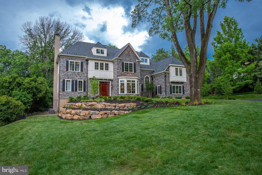 Another masterpiece by Award Winning Builder, William G. Smith, Jr., finished and ready for immediate occupancy.  It is located in prestigious Gladwyne, PA.  This home is a combination of Contemporary and Traditional Main Line Philadelphia Design.  Built to the highest standards of quality with 5 Bedrooms, 6 full Baths, and 2 Powder Rooms. The home is elegant, and at the same time offers a casual life style.   It is very spacious for any type of occasion, and lends itself to entertaining both indoors and outdoors.  Enter through a Custom Mahogany front door with side light windows into a beautiful Center Hall with a Grand Staircase that has a Magnificent Balustrade system. To the left of the Center Hall there is a Guest Powder Room Generous Coat closet and open Staircase to the walk-out lower level.  The Formal Dining Room is located to the right of the Center Hall, as you come in, and features a  Bay Window, that is full of light, 12 inch Crown Moldings, Chair Rail with  Wainscoting below and a Crystal Chandelier. Straight ahead of the Center Hall you will discover the Fabulous Great Room with Coffered Ceilings, and a Dramatic floor to ceiling Porcelain Fireplace that is both wood burning or gas.  Directly to the left of the Great Room, the Living Room/Study is located  with another Dramatic Porcelain Fireplace and featuring pocket doors for complete privacy.   Beyond the Great Room you will find a  State of the Art  gourmet Kitchen with Custom Cabinetry, White Quartz Counter tops, 4 Ft. Sub-Zero Refrigerator/Freezer, 4 Ft. 8 Burner duel fuel Wolf Range, commercial strength Range Hood with a split exhaust motor that is located in the attic  leaving  the kitchen completely silent,  Miele Dishwasher, Sharp Microwave.  Deep White Porcelain Farm Sink with Rohl upscale faucets, 10 Ft. Island with White Quartz Countertops and Vegetable Sink, Pendant Lights and seating for 4.  This Kitchen area is a Chef's Dream and includes a Generous Breakfast Area for informal meals  and  an outer exit to a charming flagstone patio perfect for Dinning "al fresco".  The Butler s Pantry is located between the Kitchen and Dining Room with Custom Cabinetry and Wine Cooler.   Beyond the Kitchen is the Mud Room with another Powder Room, Coat Closet and Cubbies with a Storage Bench. There is access to the Back Staircase leading to the 2nd and 3rd level with the same Balustrade system as the Grand Staircase.  The entire First Level boasts 10 Ft Ceilings and 12 inch Crown Moldings and Finished in Place 3/4 inch Hardwood  Oak Floors.  As you go up the Grand Staircase to the 2nd level you will notice the well appointed detail to finishes that sets this home apart from others.  Enter into the Main Bedroom with Coffered 15 ft. ceilings, 2 Walk-in Closets and fabulous ensuite  bath with Cararra Marble Walls and Floor, imported from Italy,  Large Shower with 3 Shower Heads, Seamless Glass shower doors, 2 vanities with a makeup station in the middle, a 70 inch Free Standing Soaking Tub and a Water Closet with pocket doors for privacy complete this ensuite.  There are 4 other generous bedrooms each with its' own full ceramic  bathroom and walk in closet.  The Laundry center is located on this level and is outfitted to accommodate either Gas or Electric Appliances. 4 generous Linen Closets are located on this level.   The back staircase leads you up to the unfinished 3rd Level which  is suitable for 2 more bedrooms and is plumbed for another bath. Off the Center Hall on the Main Level to the left as you enter there is an  Open Staircase that leads to the finished Walk-out lower level.  This level is complete with a full ceramic Bathroom and  2 generous  rooms each with 9 Ft. Ceilings and 12 inch crown moldings and  French doors that lead to the rear of the property.   This home is maintenance free and the location can not be beat! Arrange your tour today!  See Virtual Tour Attached.