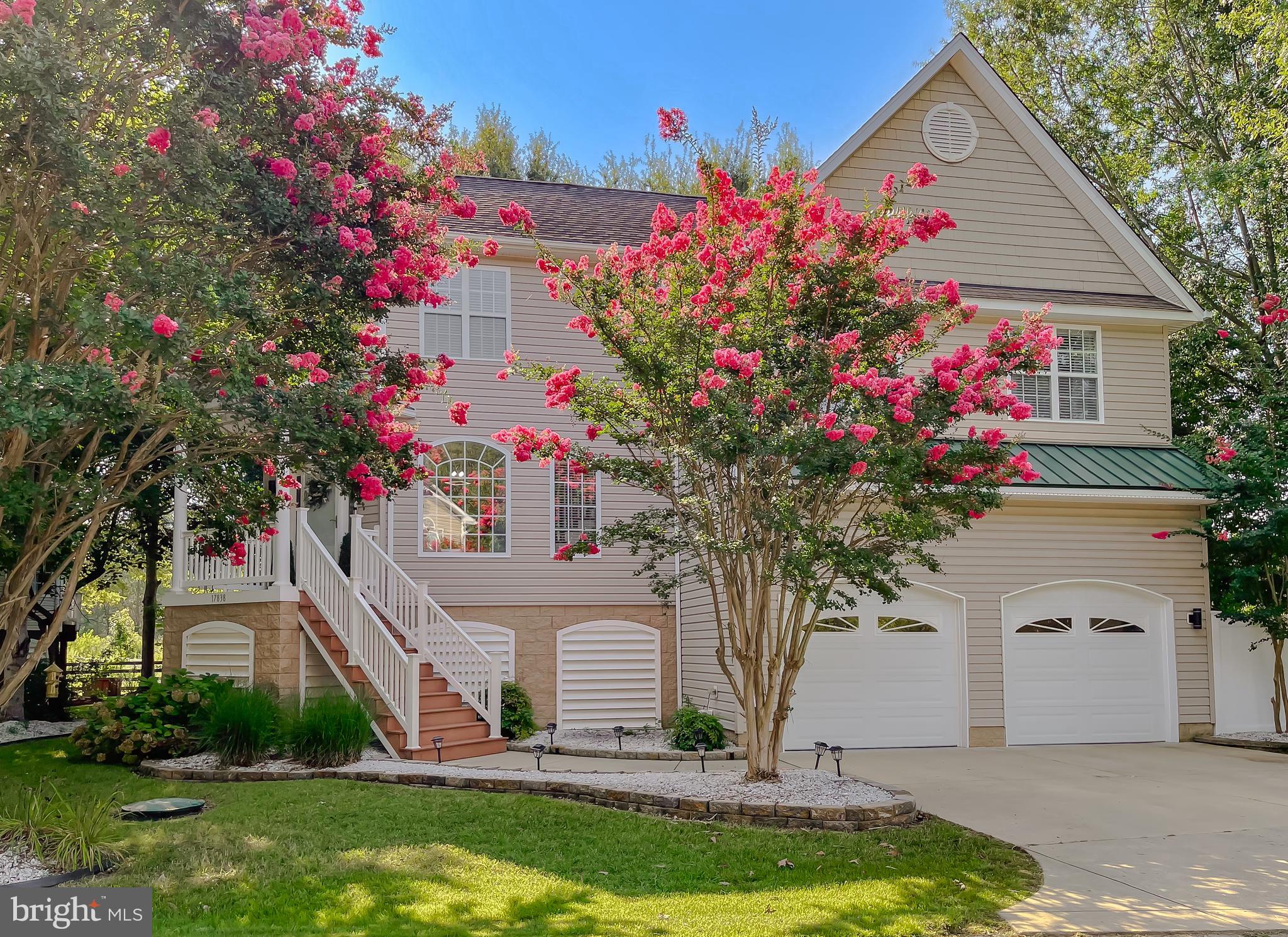 Step into this beautifully upgraded and thoughtfully designed coastal-style home offering nearly 2,500 square feet of elevated living space and exceptional outdoor living. This home is located at the end of a dead end street and backs to a peaceful farm for added privacy and tranquility. This home is loaded with features that make everyday living feel like a retreat. The main level greets you with gleaming hardwood floors, 9-foot ceilings, and a spacious living area filled with natural light. The open-concept family room includes recessed lighting and a cozy gas fireplace—perfect for year-round comfort. The kitchen is as functional as it is stylish, boasting Quartz countertops, stainless steel appliances, 42” cabinetry, subway tile backsplash, and a wet bar—ideal for entertaining. Just off the kitchen, enjoy casual meals in the breakfast nook or step outside to a massive maintenance free composite deck overlooking the fully fenced, level backyard enclosed with low-maintenance vinyl privacy fencing. The yard is also equipped with an underground sprinkler system. Retreat to the private primary suite just a few steps up from the main level, featuring vaulted ceilings, a large walk-in closet, and a beautifully tiled en-suite bath. The upper level offers three more generously sized bedrooms, including a second primary suite and a Jack-and-Jill bath with updated tile throughout. The oversized two-car garage features an epoxy floor and opens to a dedicated workout room. An expansive unfinished space offers plenty of room for storage. Two newer HVAC systems with UV lights (2023) for maximum efficiency and comfort. Located just minutes from Piney Point Lighthouse, recreation areas, and a public boat ramp. Convenient access to Patuxent River Naval Air Station, shopping, dining, and more. Don’t miss your chance to own this one-of-a-kind property that checks every box!