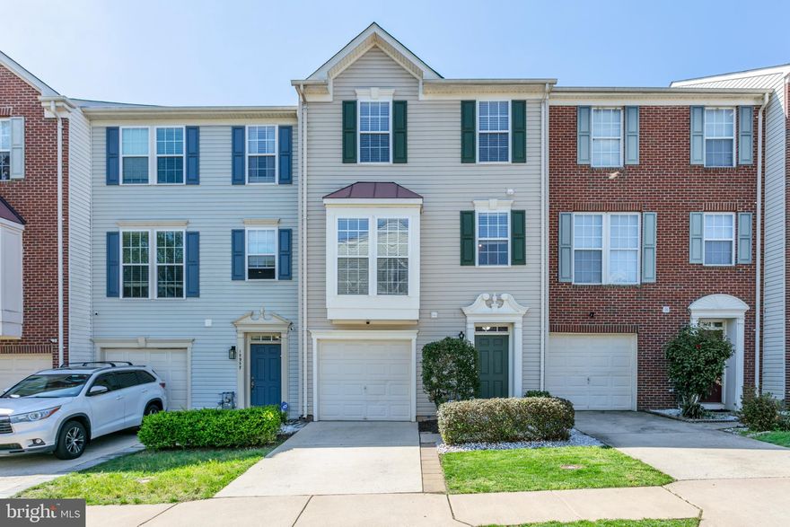 Beautifully maintained townhouse with an attached one-car garage, ideally situated just minutes from major commuter routes, shopping, and dining—Stone Bridge Shopping Center is only 5 minutes away! Plus, it’s conveniently close to the VRE for easy travel. 

The bright, open-concept kitchen features a center island and flows seamlessly into the dining area and cozy family room with a fireplace and sliding glass doors that lead out to the deck—perfect for entertaining. A separate, generously sized living room sits just off the kitchen, offering additional space for relaxing or hosting guests.

Upstairs, the spacious primary suite includes a walk-in closet and a completely remodeled en-suite bathroom boasting a dual-sink vanity, a luxurious soaking tub, and modern finishes throughout. 

The entry level includes a half bath, laundry room, and a huge rec room with walkout access to the fenced backyard—great for pets, play, or gardening. Located at the end of a quiet loop with no through traffic, the home is just a short walk to the community center and pool.