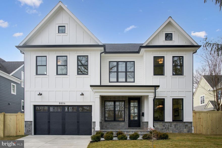 Welcome to 8804 Montgomery Avenue , a stunning new 6BR, 4.5 BA custom home in the highly desirable close-in Village of North Chevy Chase. This stately home offers approximately 5,000 sq. ft. of beautiful living space for gracious living.  Every inch of this magnificent home has been meticulously planned and built using the highest quality materials, craftsmanship and interior design aesthetic. The curb appeal will wow you as you walk up not the covered front porch with flagstone floor. The first floor has a wonderful, open floor plan with well-proportioned living space. The large living room and dining room spaces are ideal for entertaining. The dining room features a fabulous butler’s pantry/entertainment area with glass front cabinetry, custom decorative shelving, and wine refrigerator.  Preparing meals will delight any chef in the fabulous kitchen equipped with all the bells and whistles including top of the line Jenn Air luxury Rise appliances. The massive island with quartz waterfall countertop allows for easy food preparation, seating, and serving as well. Whether relaxing casually with loved ones or hosting guests, there is no better place to enjoy meals and special gatherings. The focal point of the great room is the gas fireplace with custom wood surround and mantel. The main level also offers a large bedroom with en suite bath, charming powder room and large mud room directly off the kitchen with entry from the garage. At the top of the stairs with custom iron railings is a large multi-use space perfect for a study area or lounge area.  The second floor features a dream primary suite with luxurious spa bath, two spacious walk in closets and linen closets.  On the second level, there are three more spacious bedrooms, one with its own en suite bath and walk in closet and two of which share a large connecting bathroom with double vanity. Laundry is convenient in the bedroom level laundry room complete with front loading washer and dryer and custom cabinetry.   The lower level with outside egress offers a large family room/ multi-use room with wet bar with custom cabinetry, beverage refrigerator, large bedroom, and full bath, and exercise room with mirrored wall.  The spacious, flat backyard is fully fenced. Location, location, location! You will love living in the heart of North Chevy Chase  and being able to walk to the heart of Chevy Chase Lake and all it has to offer.  Just minute to  I-495, Kensington’s MARC train, NIH, downtown Bethesda, Pike and Rose shopping and entertainment, and upcoming Purple Line.. You will love living in this beautiful home and neighborhood!