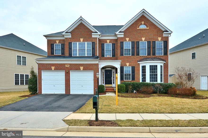 Gorgeous Brick Front Colonial w/ gleaming HARDWOOD FLOORS. Kitchen w/ GRANITE COUNTERS, SS Appliances & Large CENTER ISLAND w/ Breakfast Bar. Family Room w/ Gas Fireplace leads to 2 Tier Trex Deck. Master Bedroom w/ Tray Ceiling & Sitting Area. Master Bath w/ Luxury Soaking Tub & Separate Shower. Fully Finished Lower Level w/ Spacious Rec Room, Wet Bar & HOME THEATER! Wiring for Cable-Alarm-Sound.