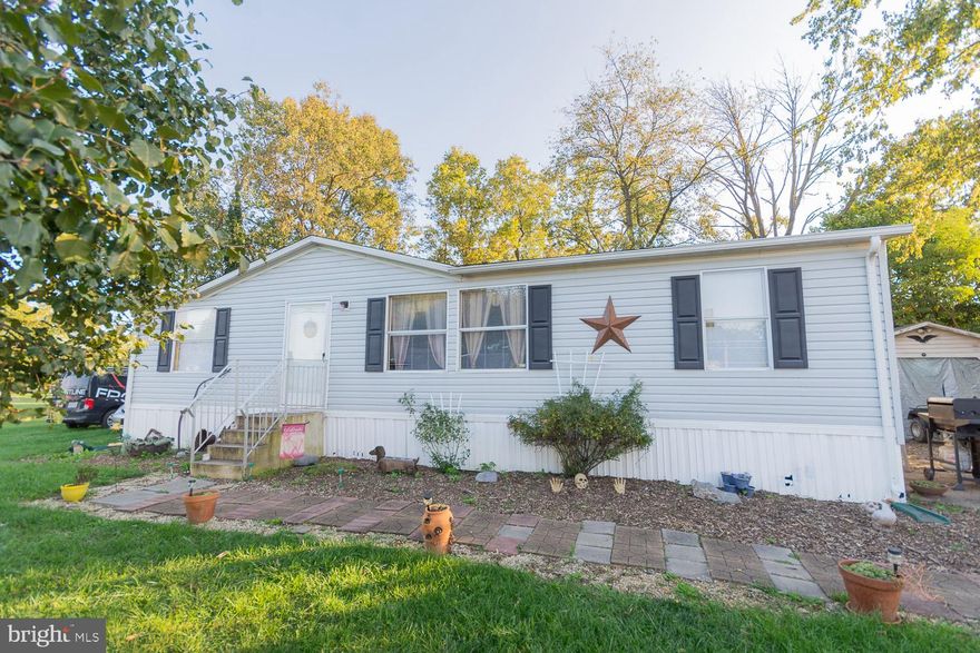 Nice doublewide home on almost a half acre. This home features a split bedroom plan with primary bedroom on one side and 2 other bedroom on the other side. There is welcoming large living room. An eat-in country kitchen with all appliances with a door that leads to the back deck. Laundry room with washer and dryer. One car garage and shed complete this home. Set up an appointment today.